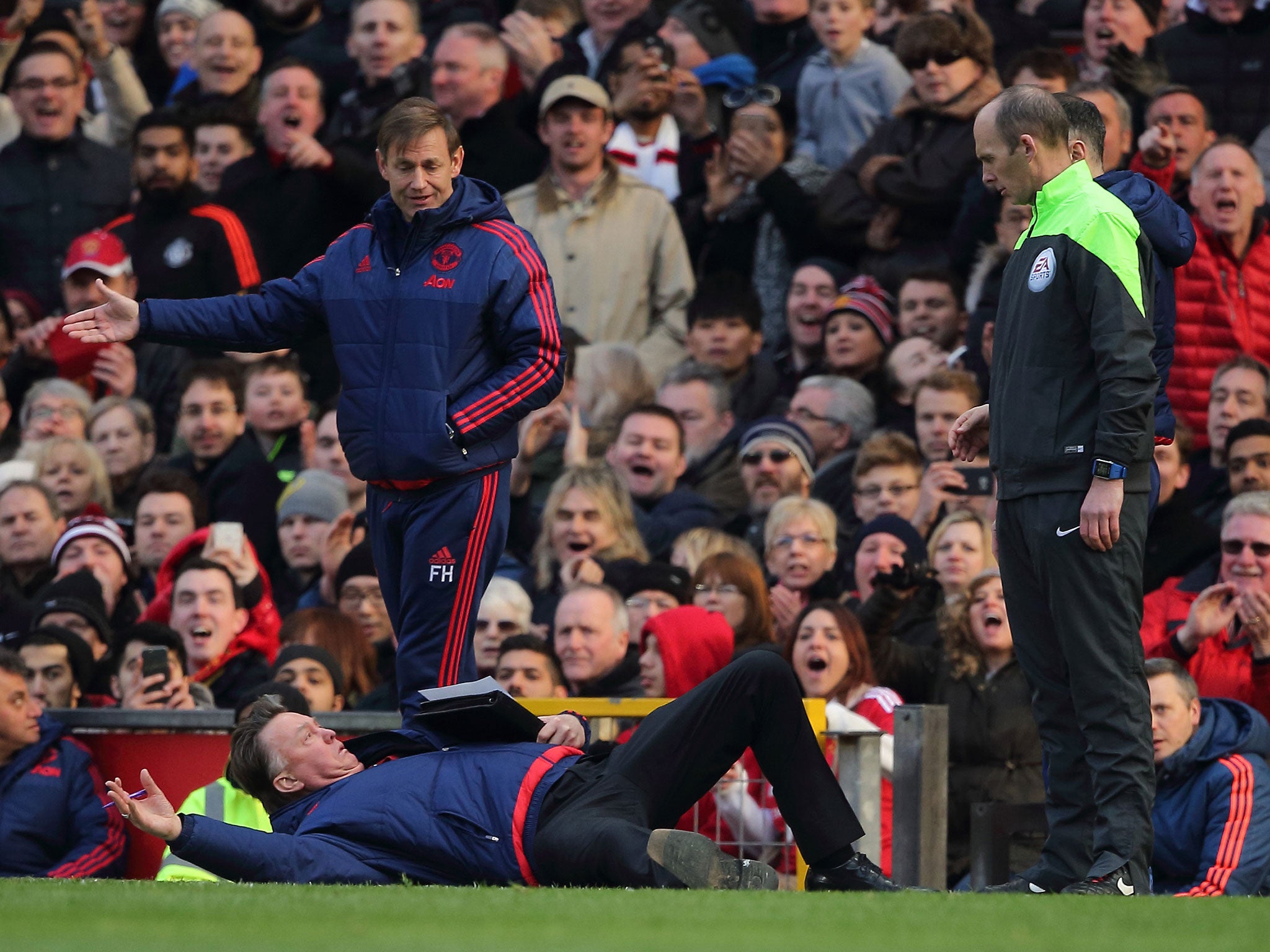 Louis van Gaal jokes on the side-lines at Old Trafford