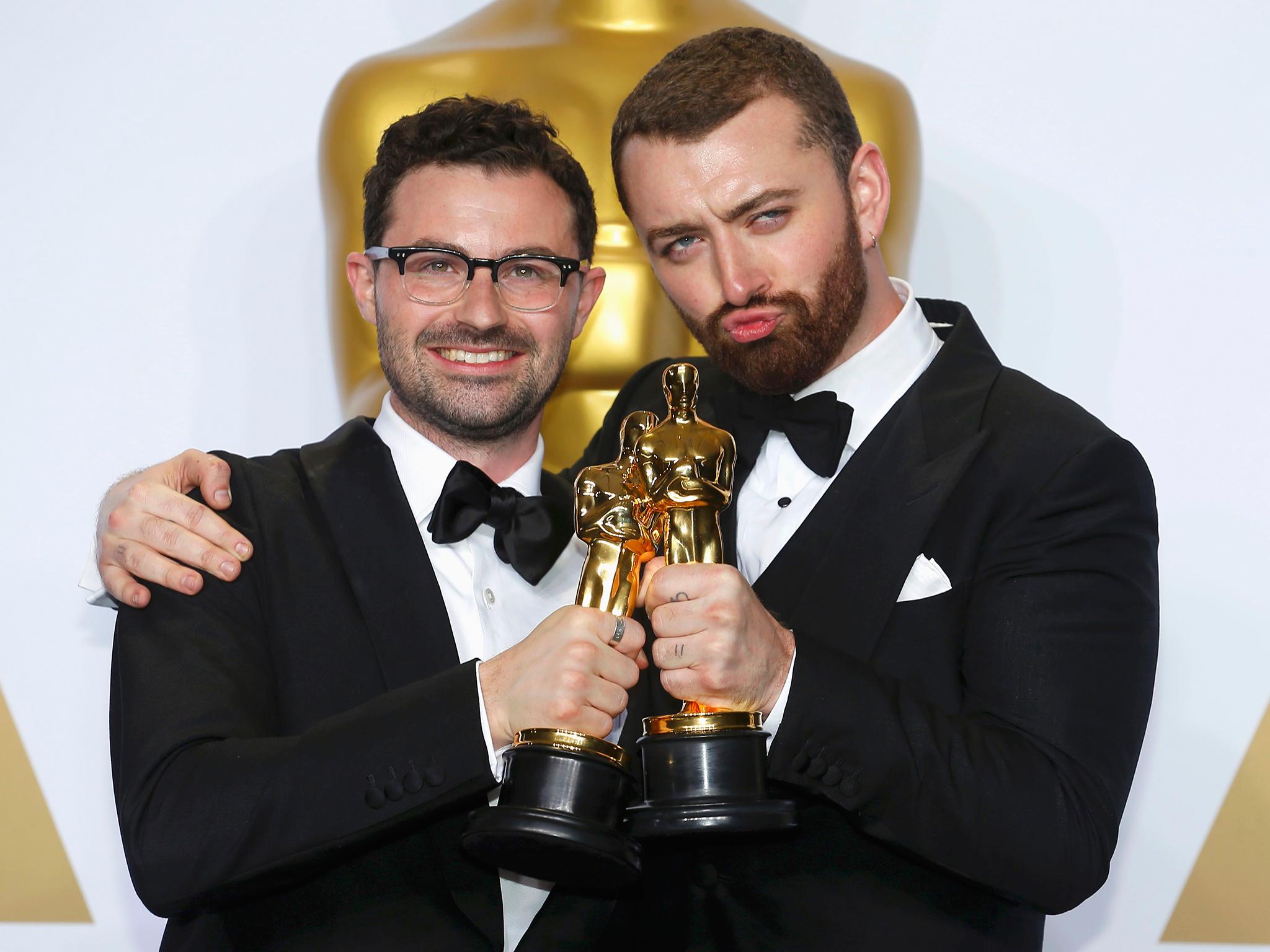 Smith and Jimmy Napes with their Oscar trophies for Best Original Song