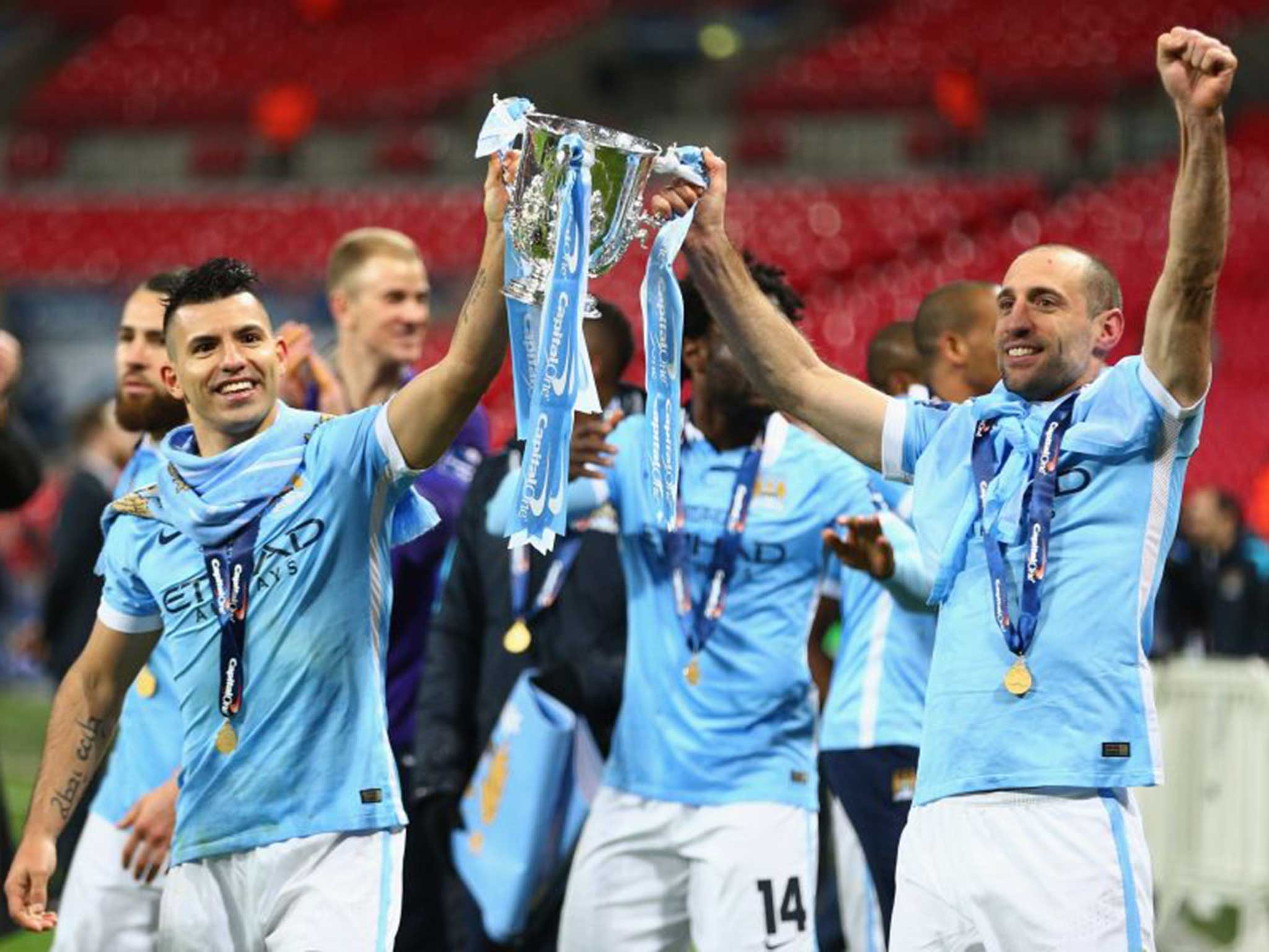 Pablo Zabaleta (right) and Sergio Aguero hold aloft the League Cup at Wembley