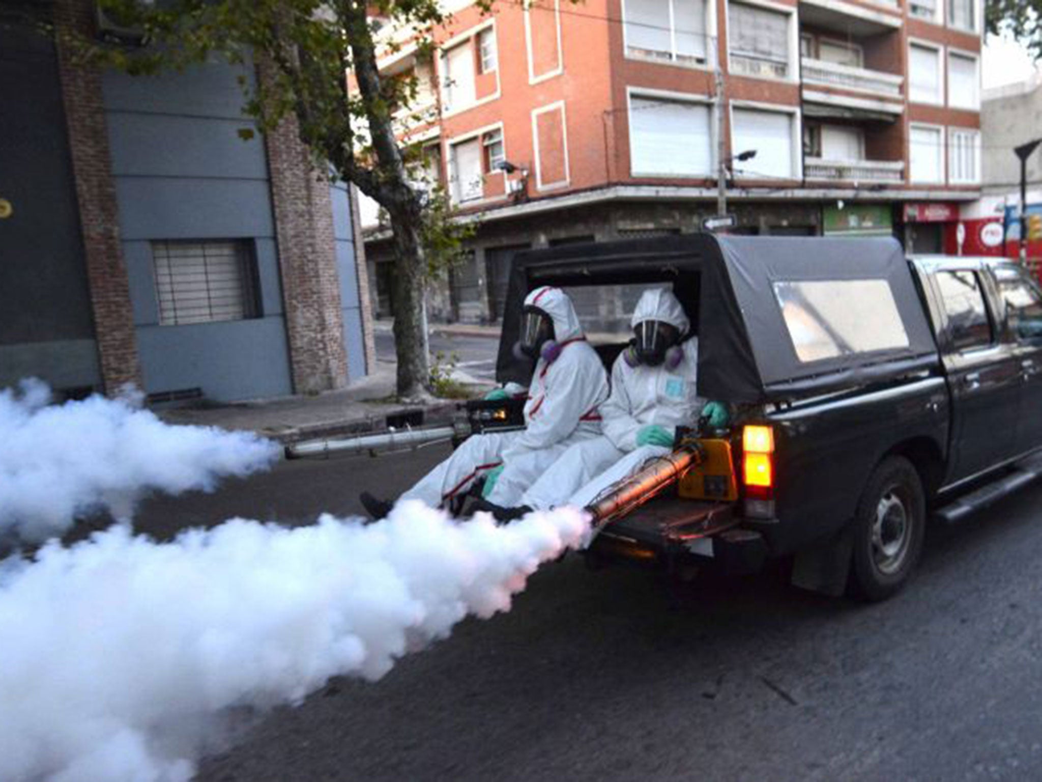 Health workers fumigating in Montevideo, Uruguay, last week to eradicate mosquitoes