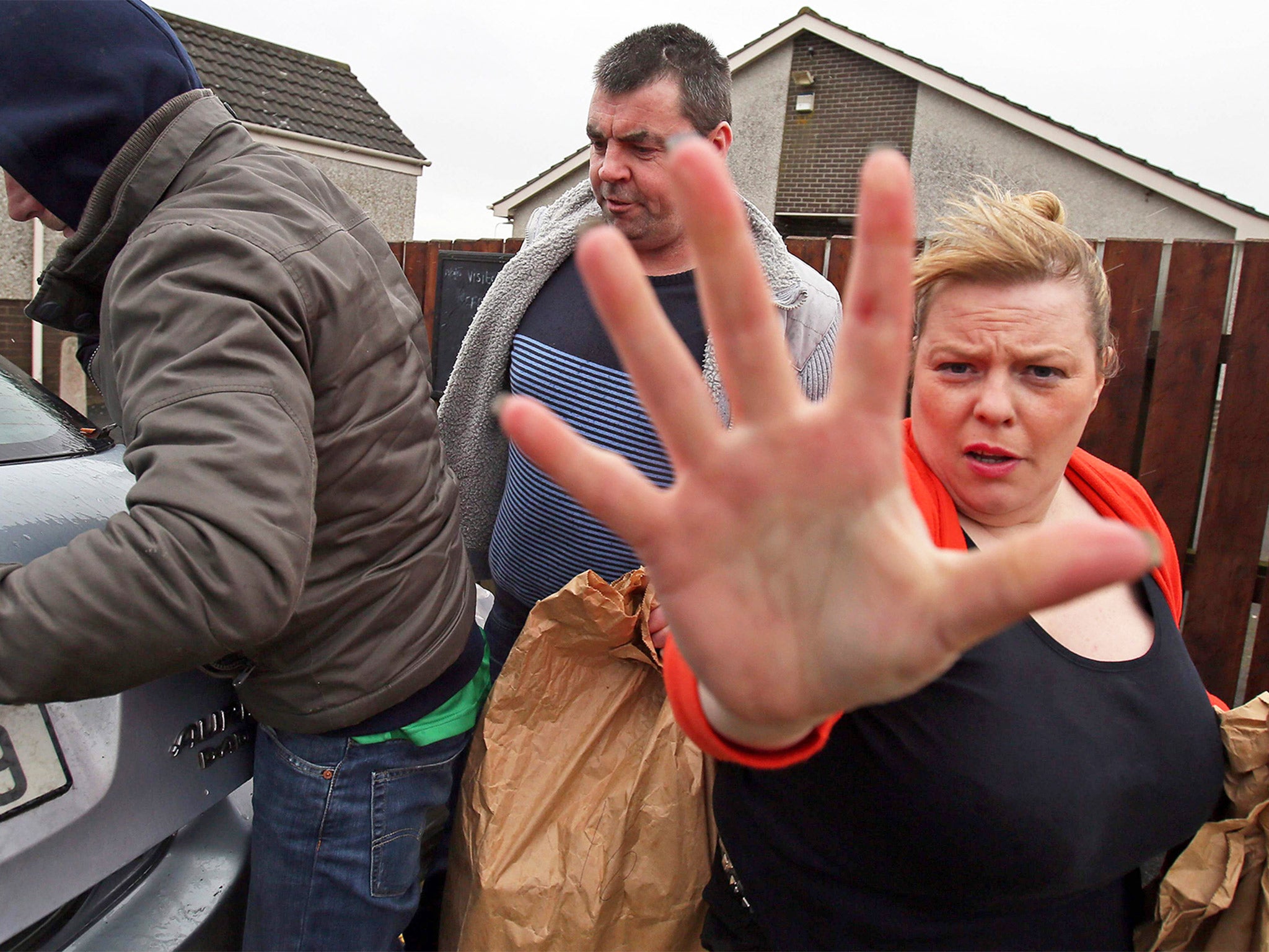 Seamus Daly (second from left) walks to a car after being released from Maghaberry prison near Belfast