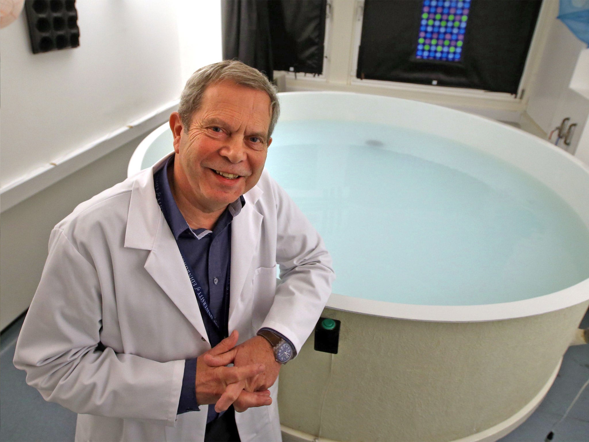 Professor Richard Morris from the University of Edinburgh Neuroscience Department beside the 'Morris Water Maze'