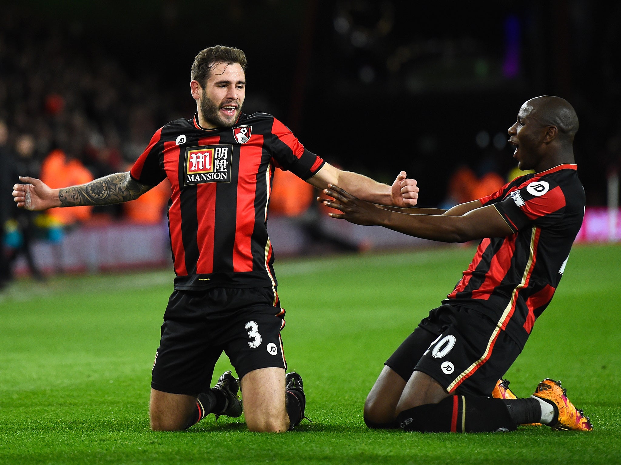 Steve Cook is congratulated on his opening goal by Benik Afobe