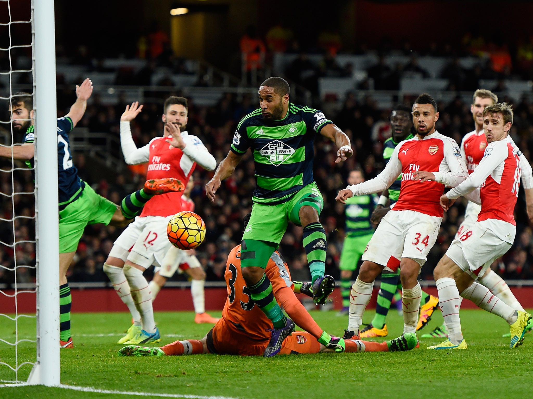 Ashley Williams scores Swansea's winning goal at the Emirates Stadium