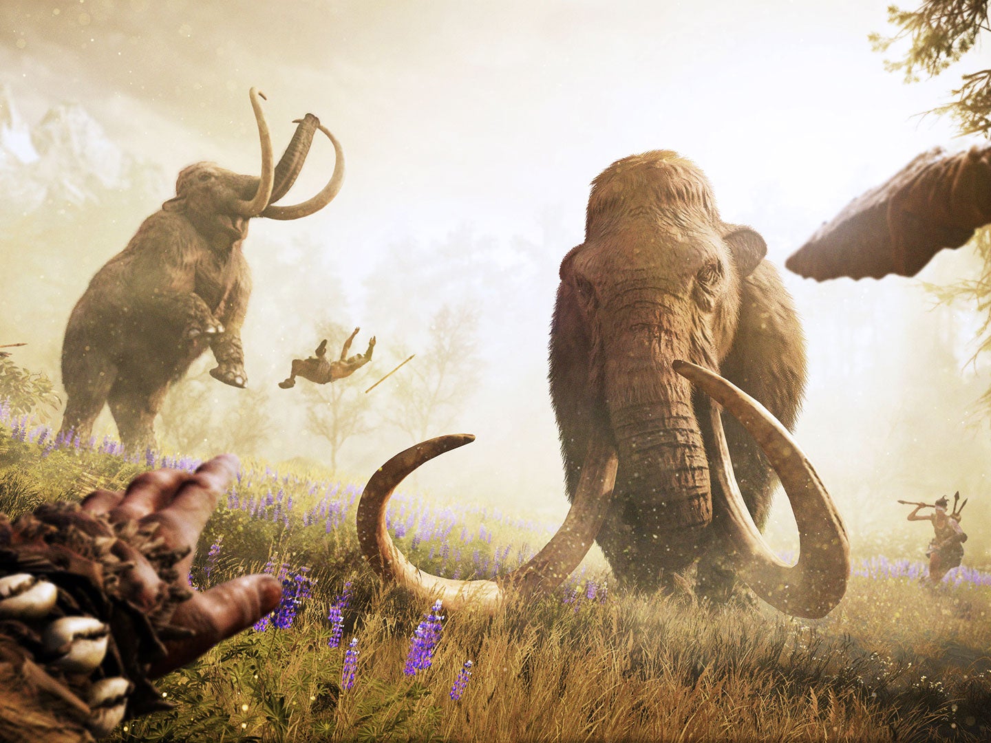 Far Cry Primal's protagonist, Takkar, takes on a wooly mammoth