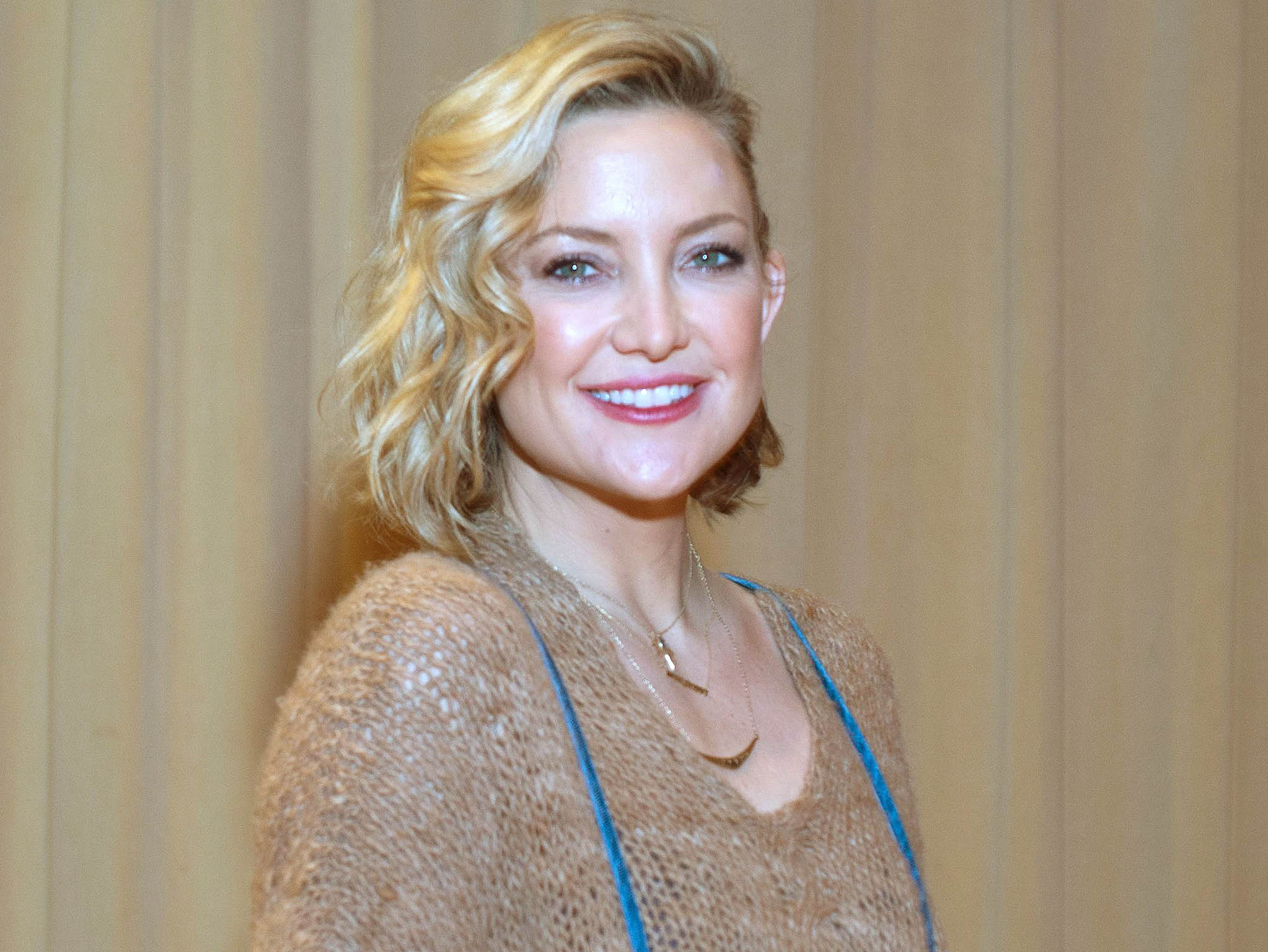 Golden smile: Kate Hudson.