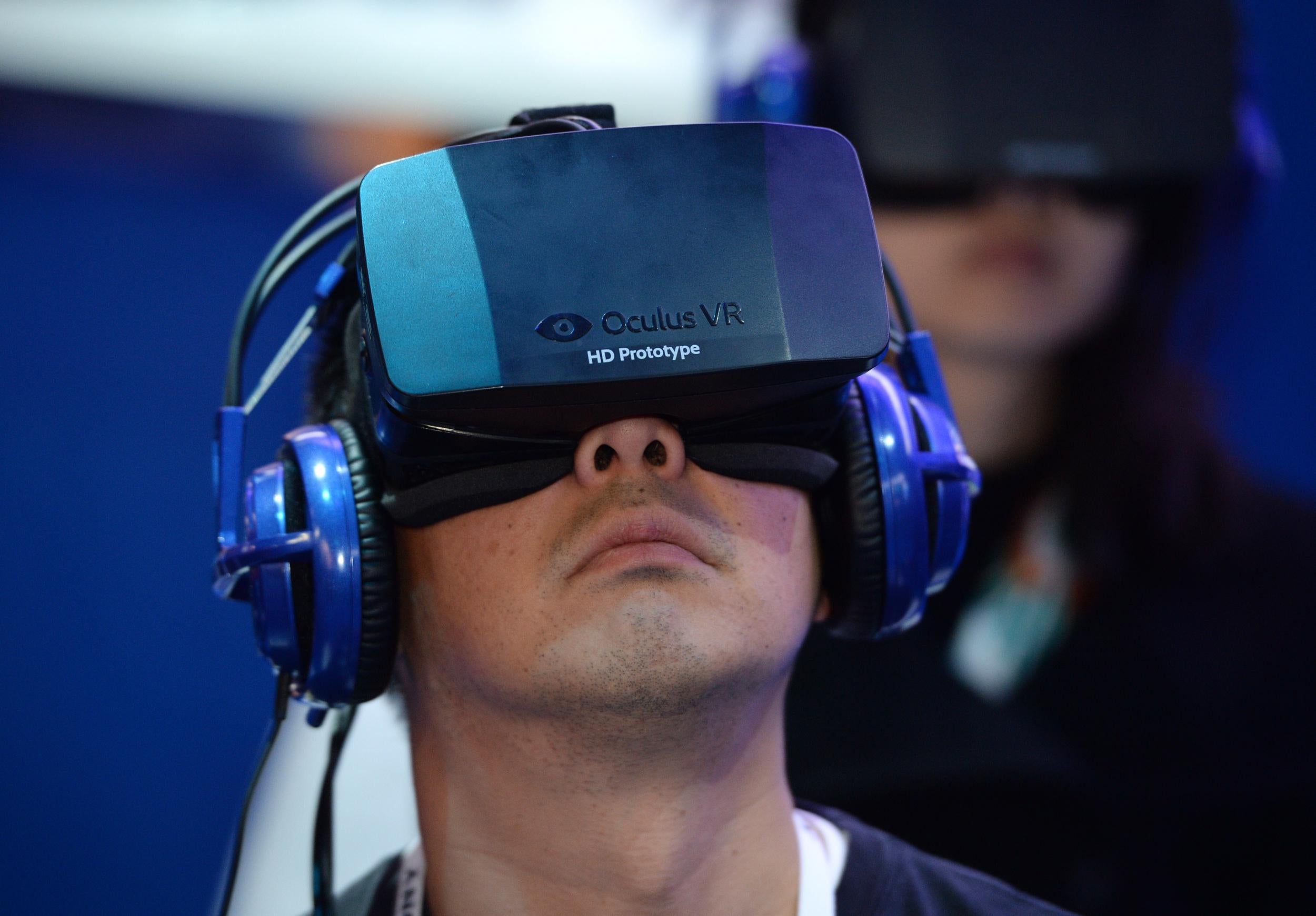 A man uses a prototype Oculus Rift at the Consumer Electronics Show in 2014