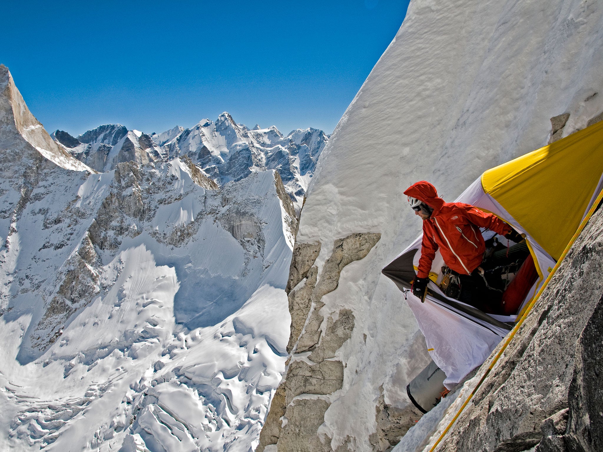 Renan Ozturk looking out of the portaledge