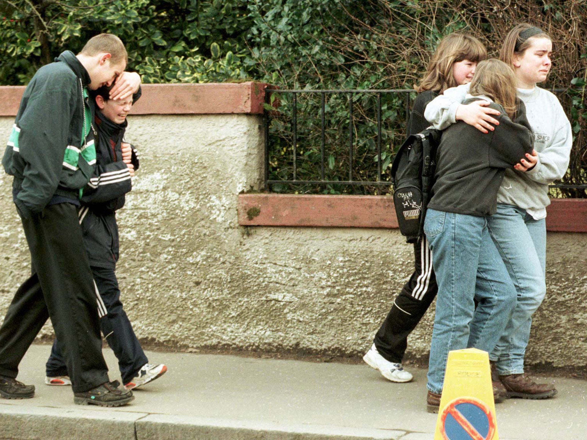 Children outside Dunblane Primary School a day after the shooting in which 16 pupils and their teacher were killed.