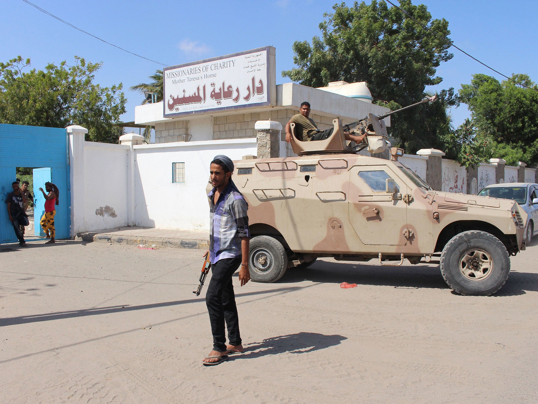 Yemeni security forces gather outside an elderly care home after it was attacked by gunmen in the port city of Aden, Yemen, Friday, 4 March, 2016