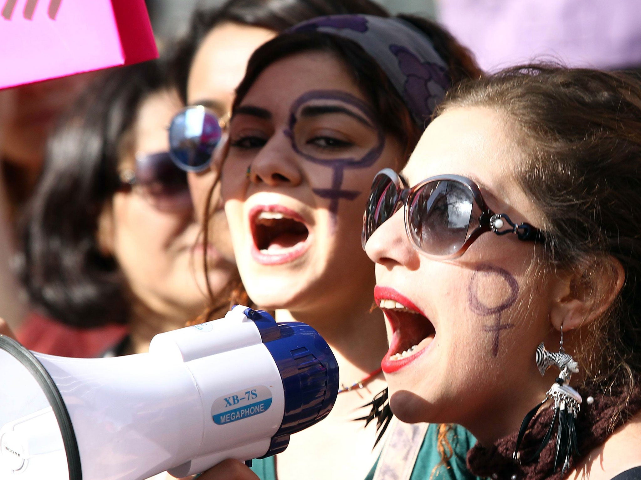 Turkish women shout slogans during a rally to mark International Women’s Day in Ankara, on March 8, 2015.