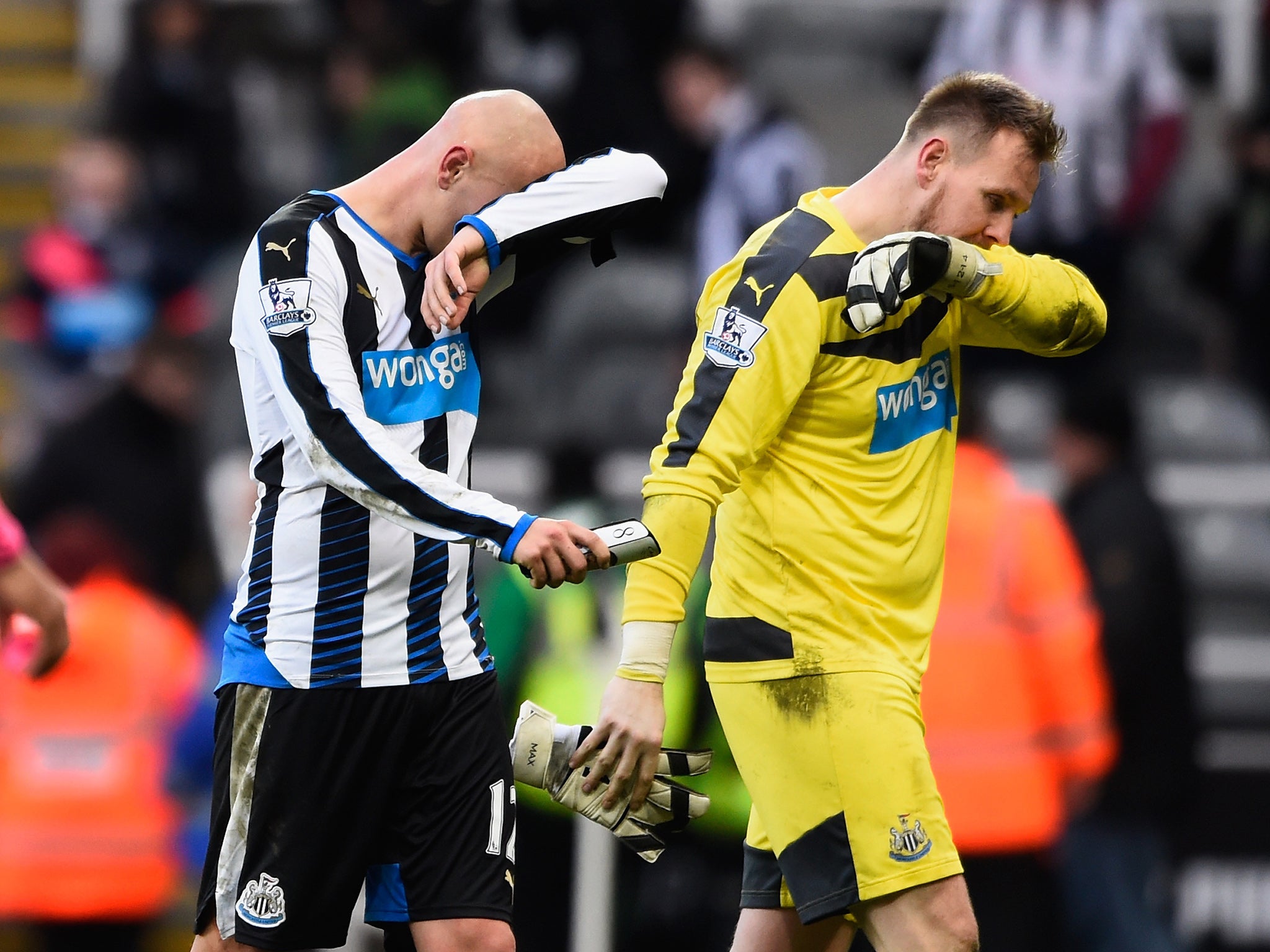 Jonjo Shelvey and Rob Elliot trudge off the pitch at full time