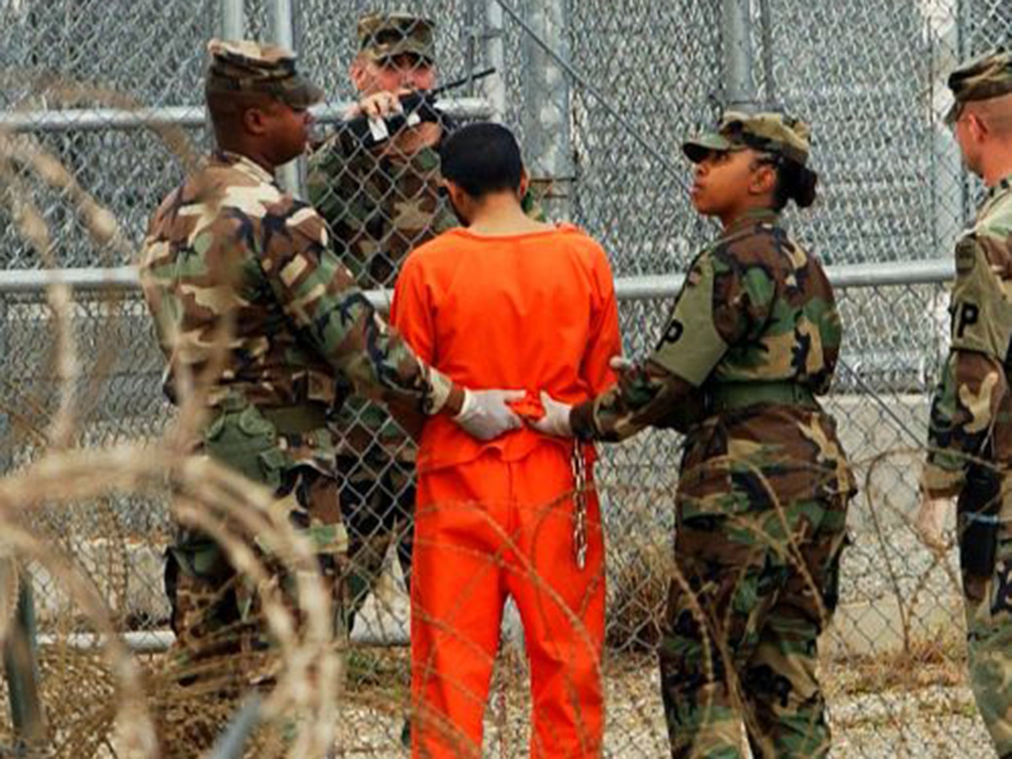 A prisoner is taken for questioning at Guantanamo