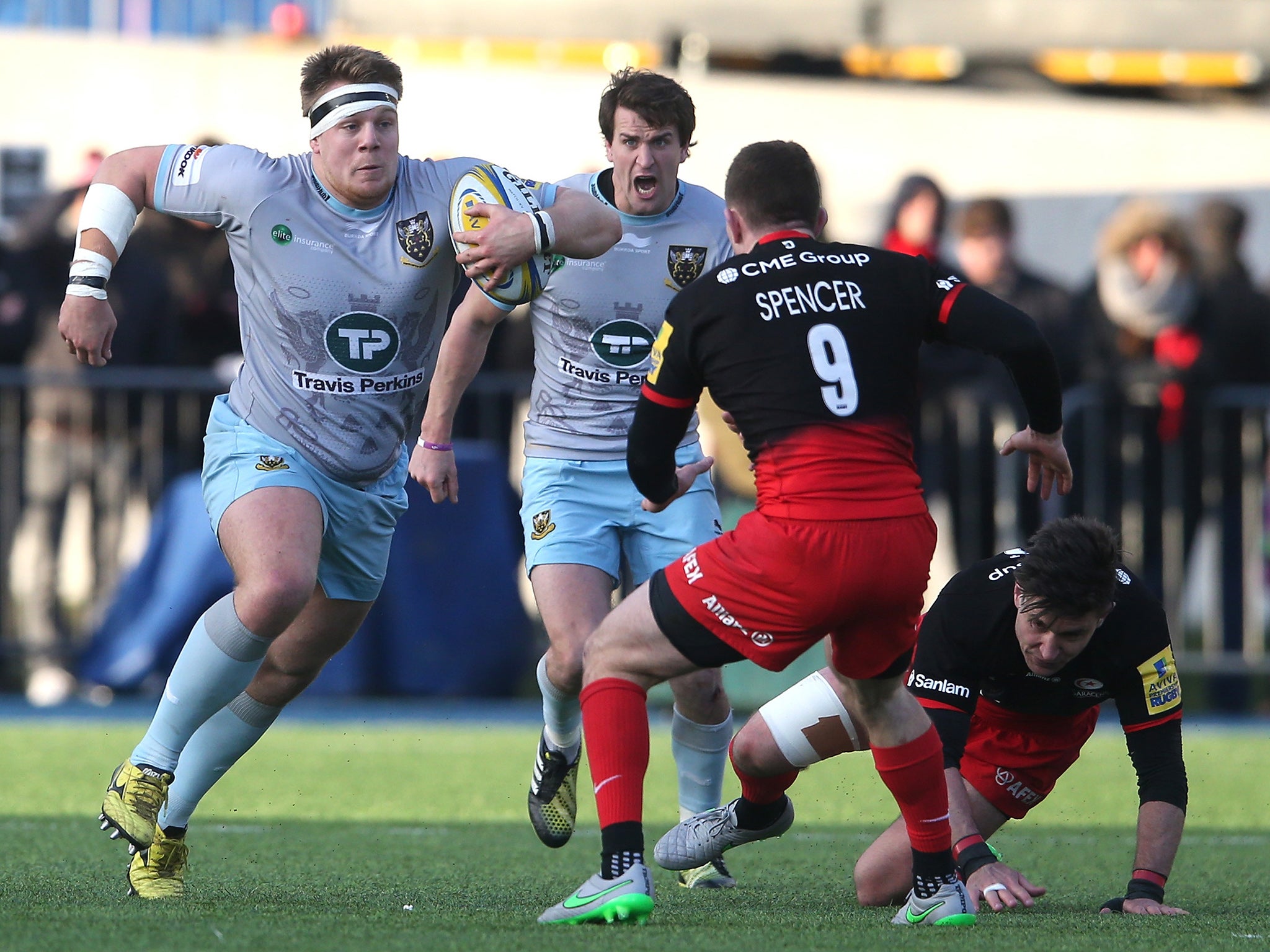 Northampton's Paul Hill takes on Saracens' Ben Spencer