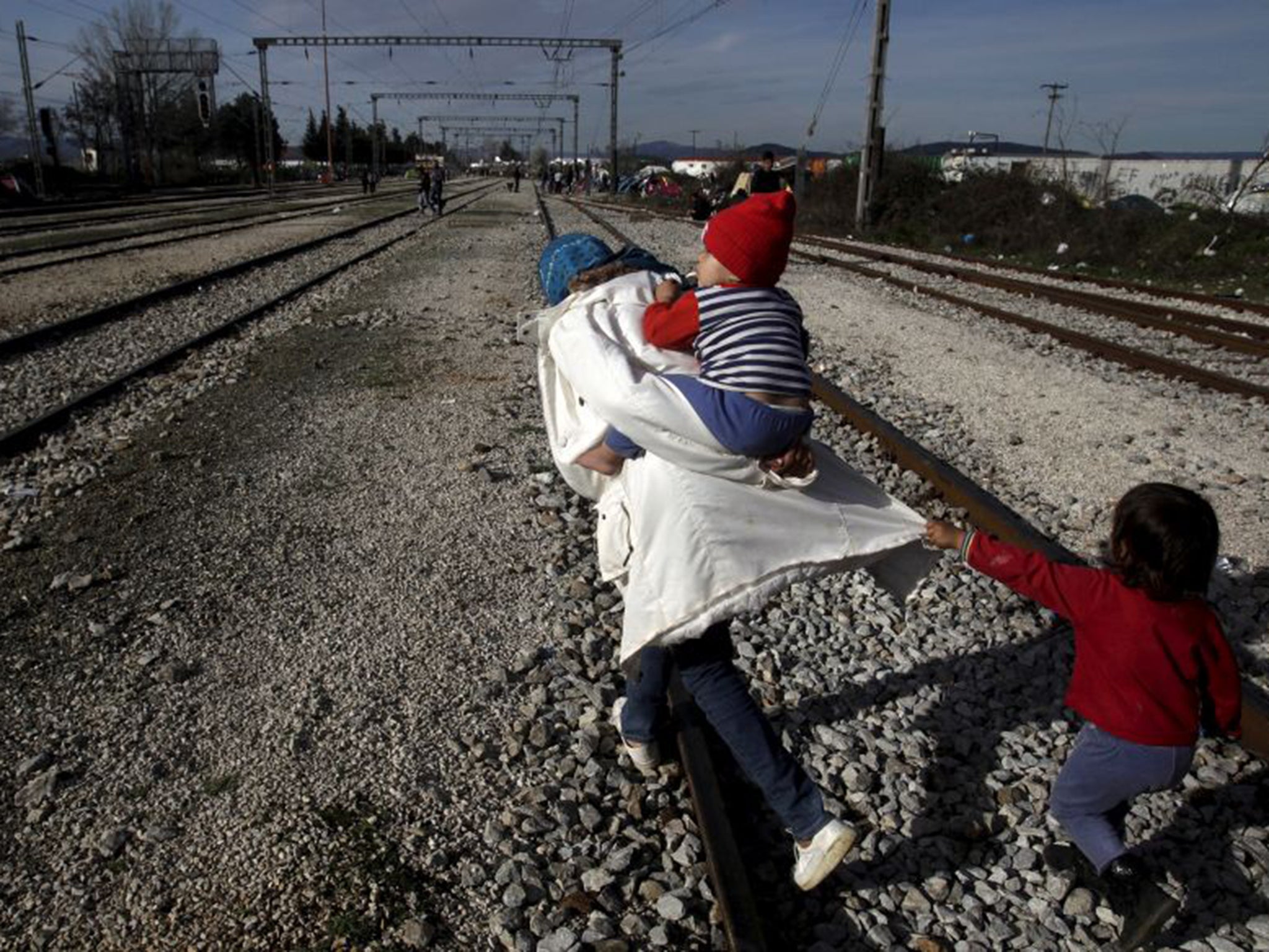 &#13;
Migrants near the makeshift camps in Idomeni &#13;