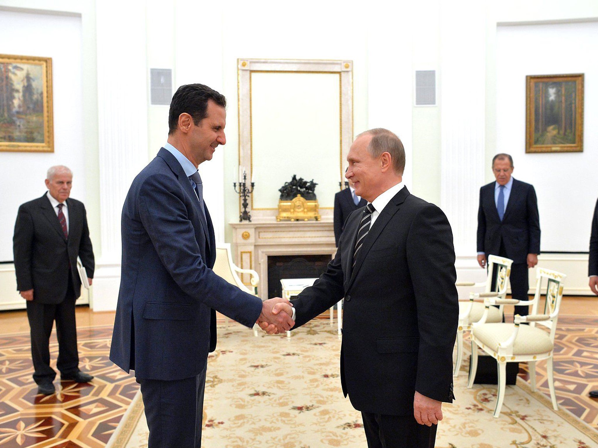 &#13;
Vladimir Putin greets Bashar al-Assad ahead of a meeting at the Kremlin in October last year. Turkey and Russia have supported opposing sides in the Syrian conflict since the uprising began in 2011 &#13;