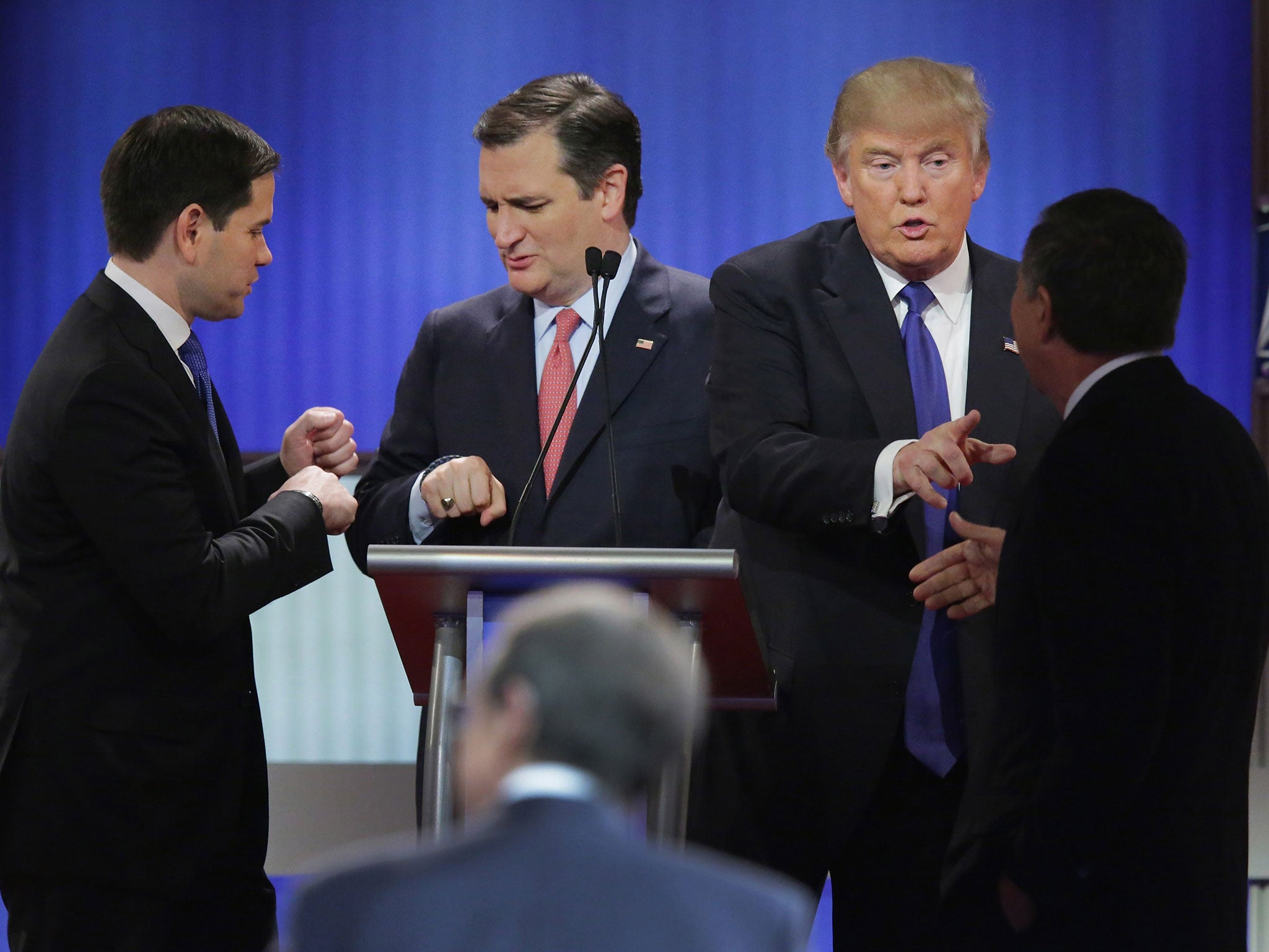 Republican presidential candidates greet each other following a debate sponsored by Fox News at the Fox theatre on March 3, 2016 in Detroit, Michigan