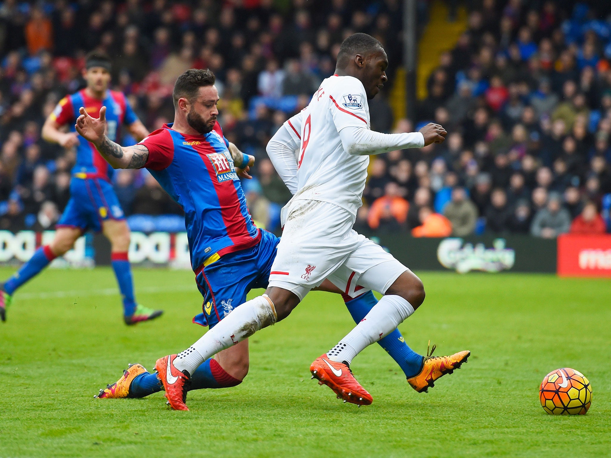 Christian Beneteke is tripped by Crystal Palace defender Damian Delaney