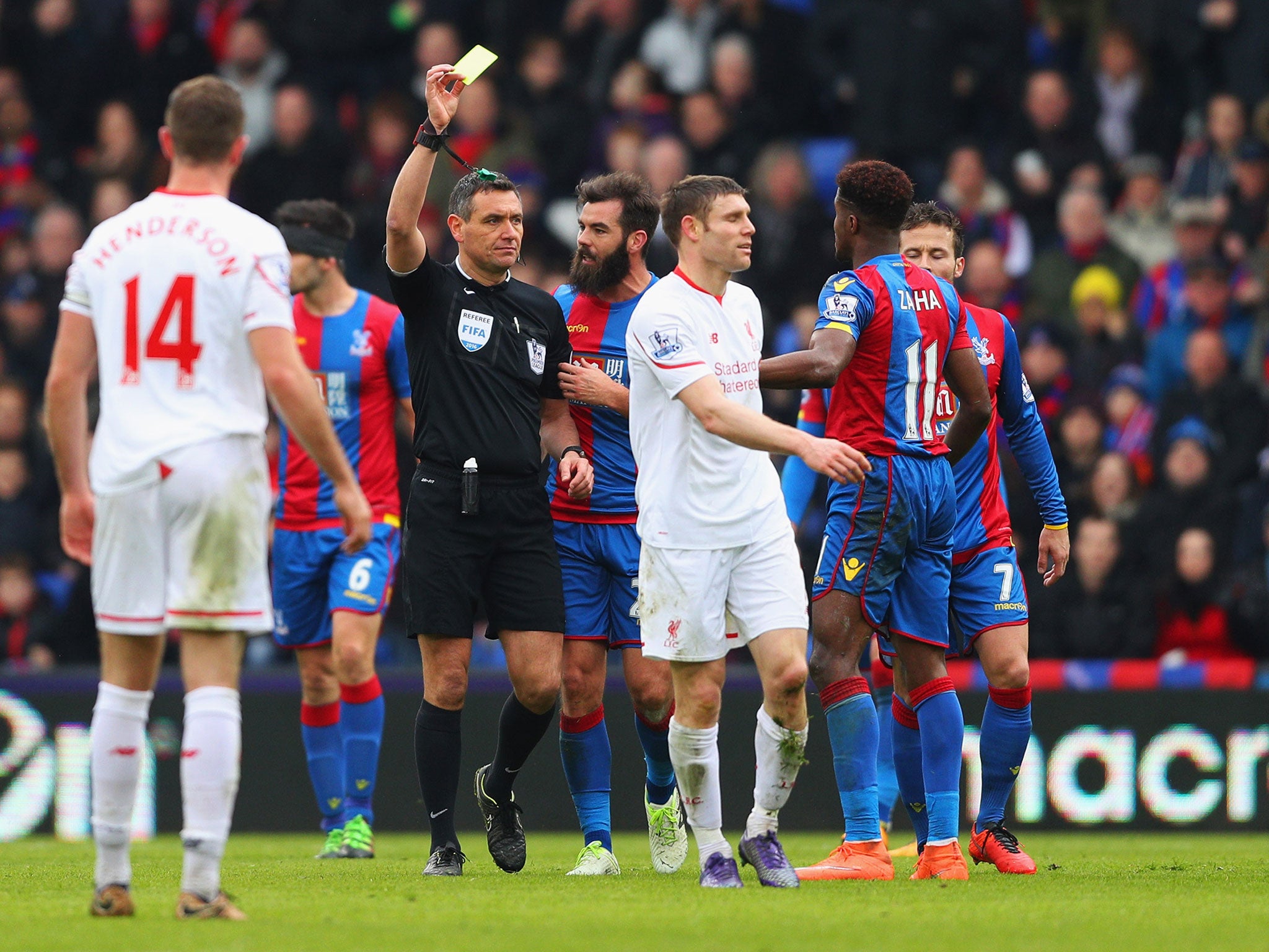 James Milner is shown a second yellow card to be sent-off during Liverpool's win over Crystal Palace