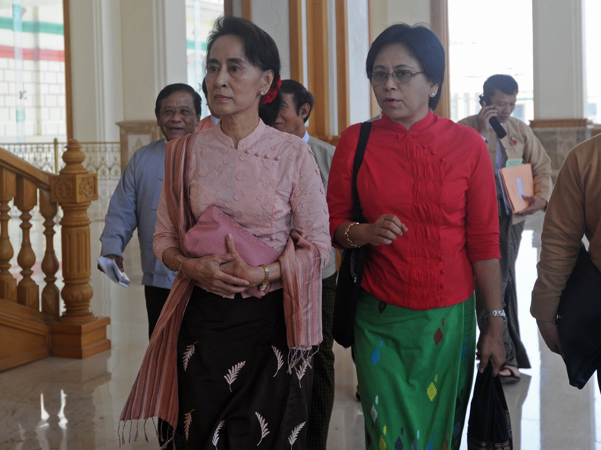 Double trouble: Aung San Suu Kyi’s companion Daw Tin Mar Aung (right) is unlikely to curb Burma’s anti-Muslim Buddhist nationalists.