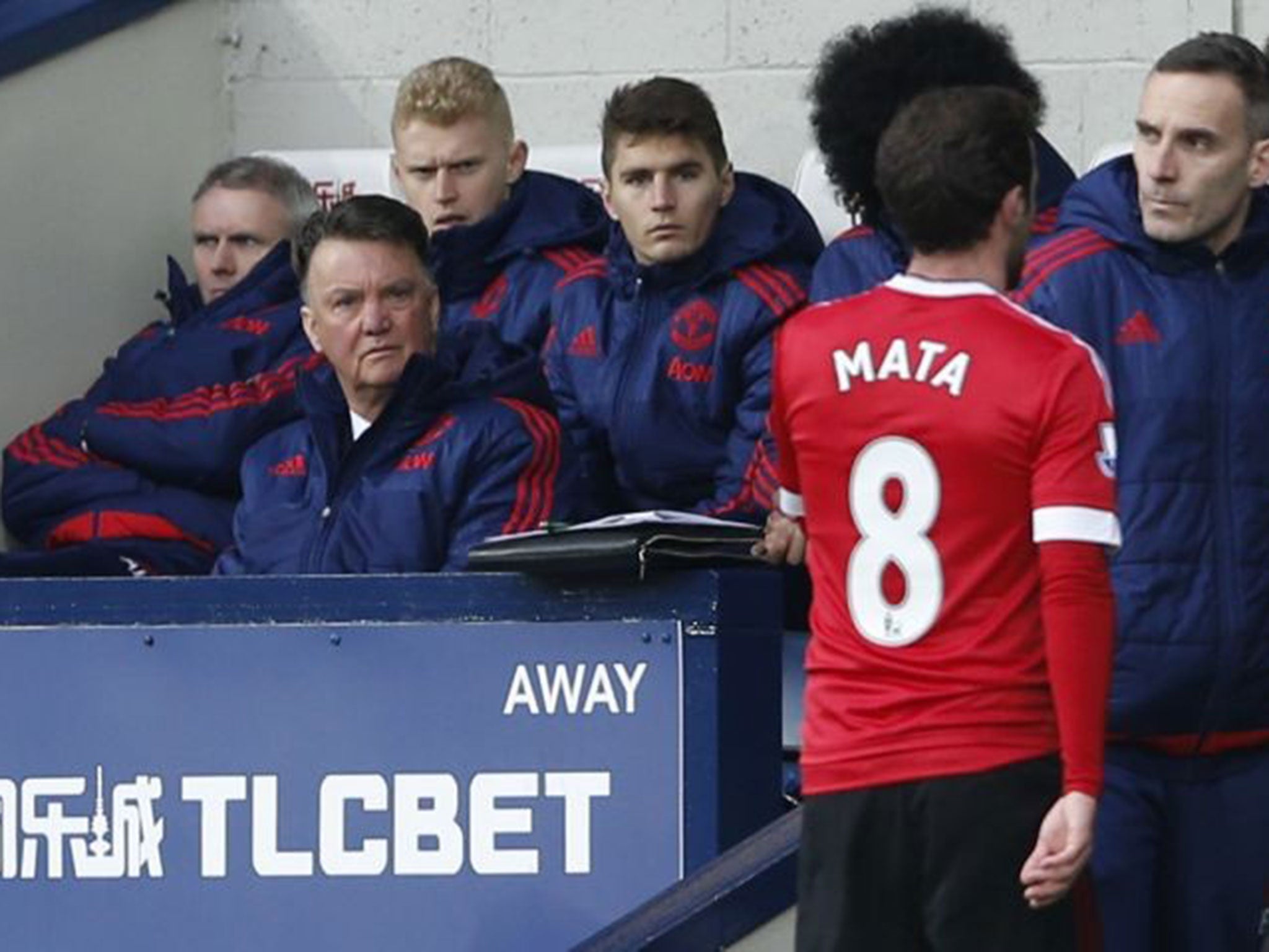 Juan Mata walks past Louis van Gaal after being sent-off