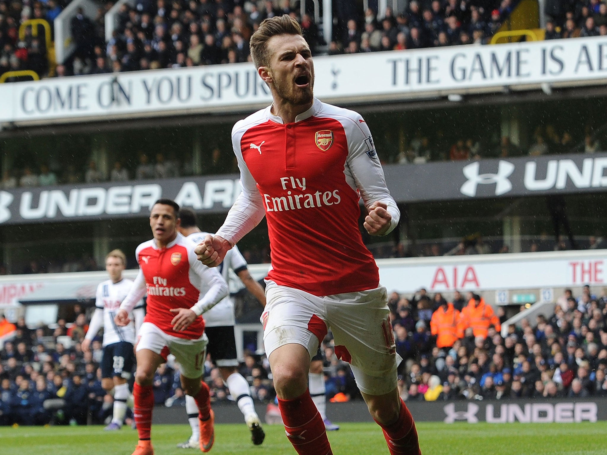 Aaron Ramsey celebrates scoring against Tottenham for Arsenal