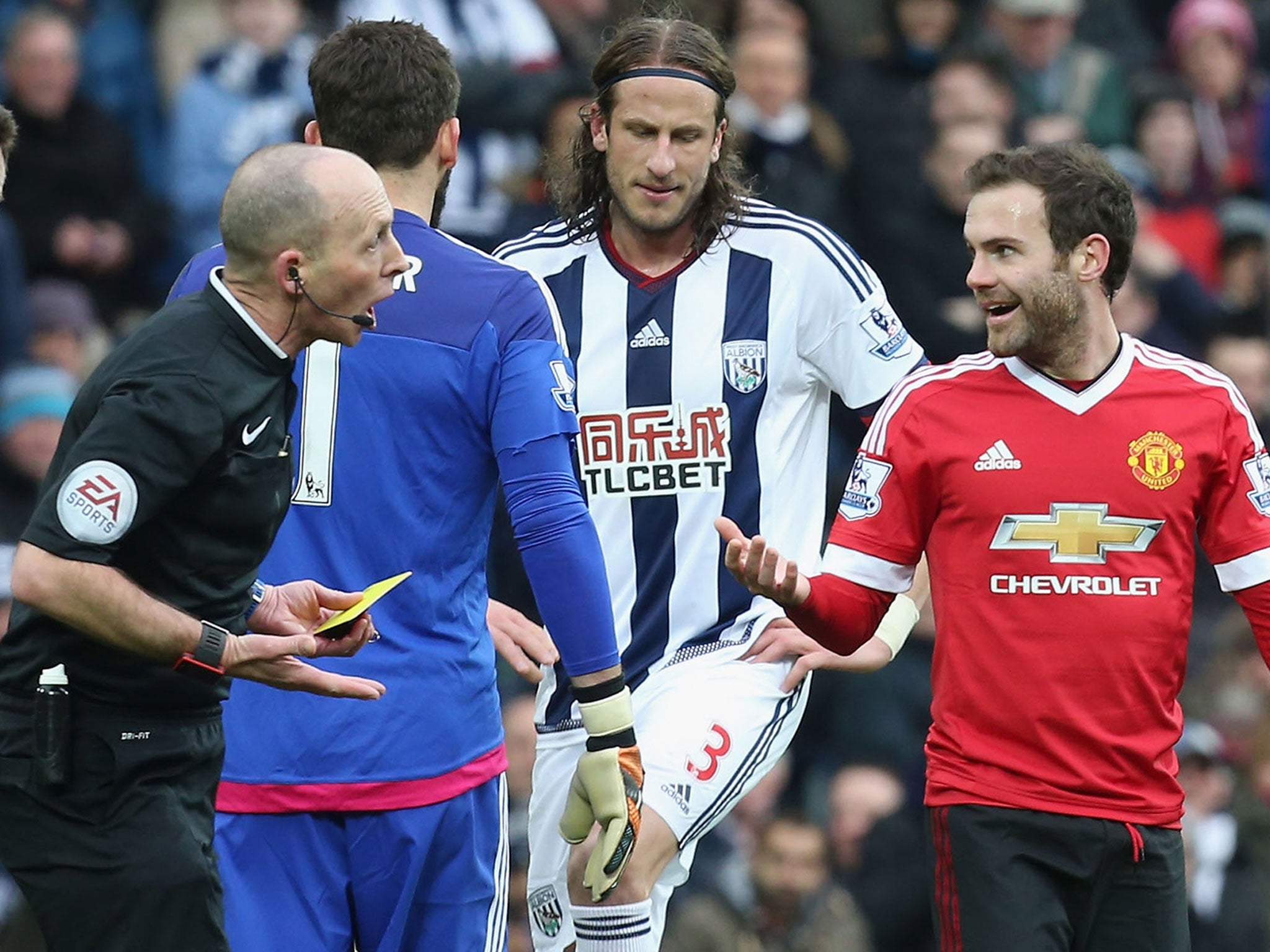 Juan Mata complains after Mike Dean shows him a red card