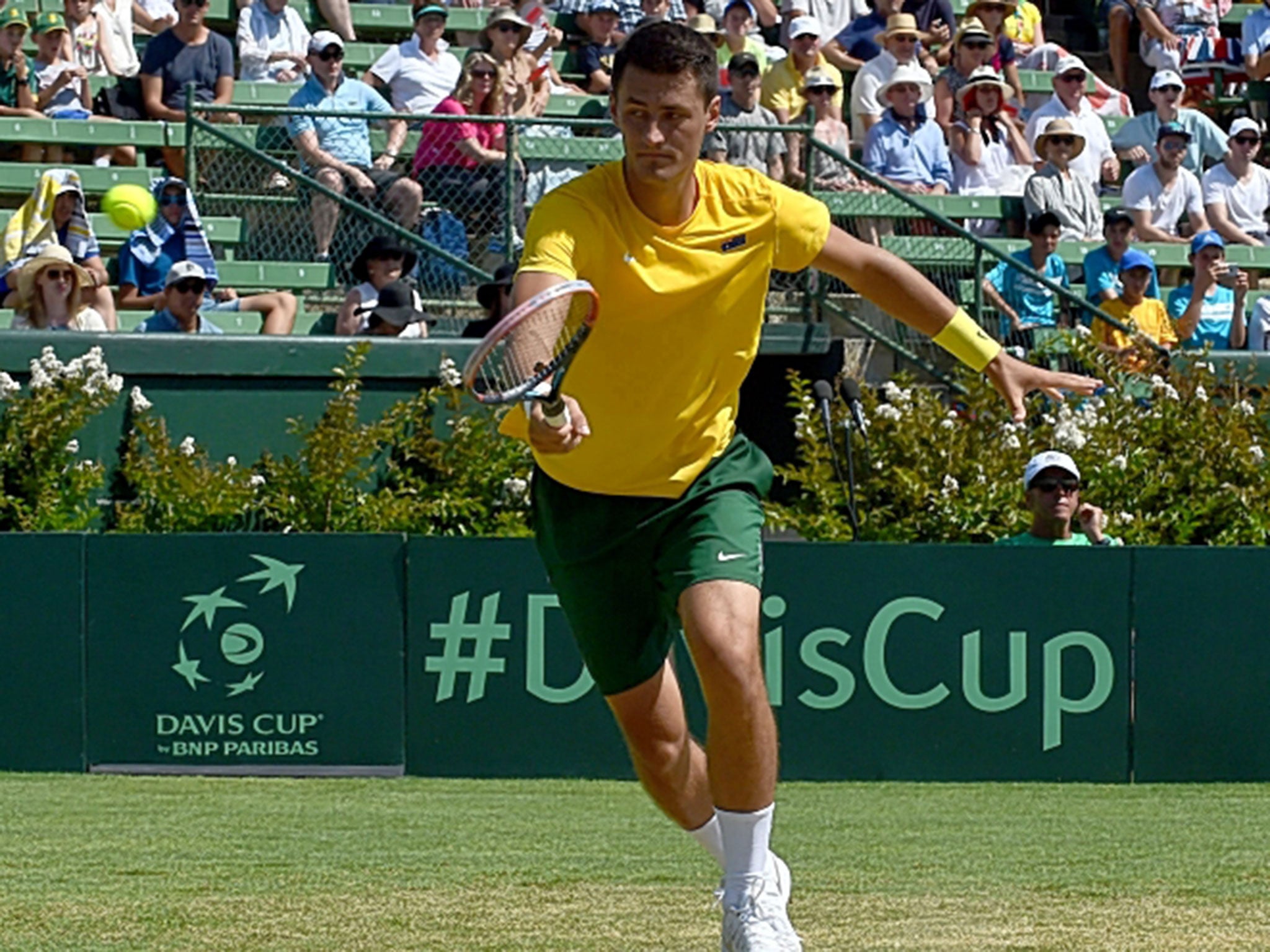 Bernard Tomic’s four-set loss to John Isner helped seal Australia’s defeat against USA