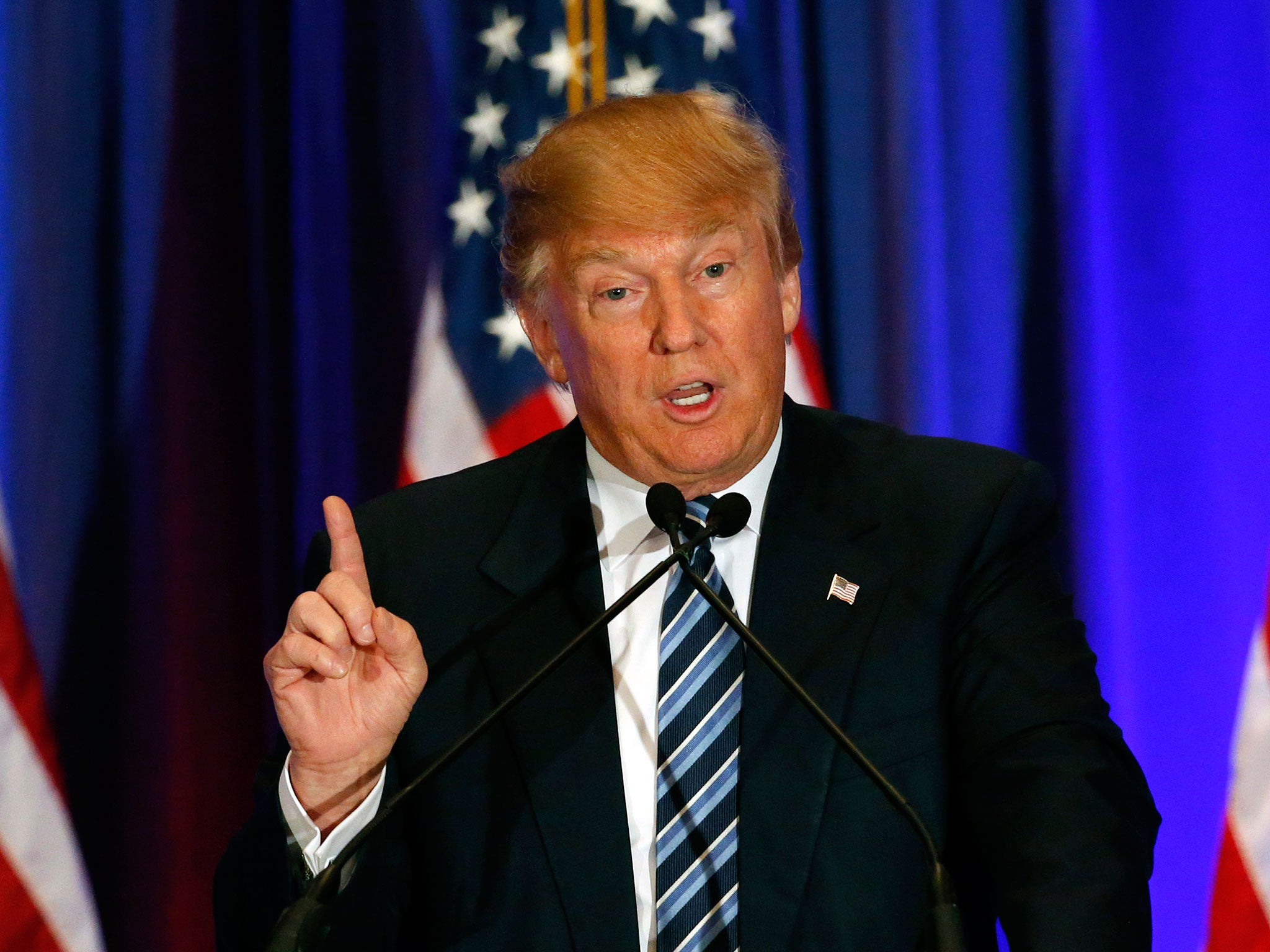 Republican presidential candidate Donald Trump addresses the media during a press conference