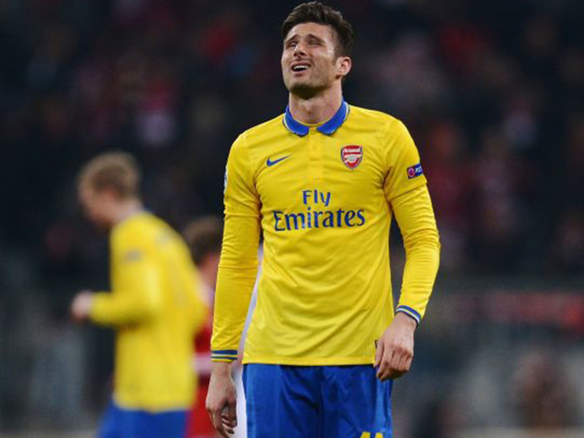 &#13;
Olivier Giroud reacts after the Champions League exit to Bayern Munich in 2014 &#13;