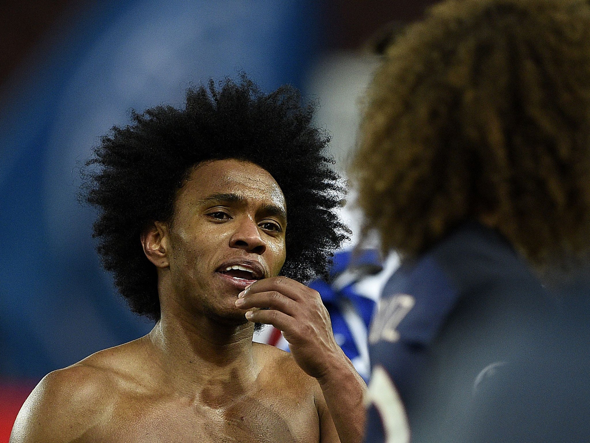 Chelsea forward Willian approaches former team-mate David Luiz