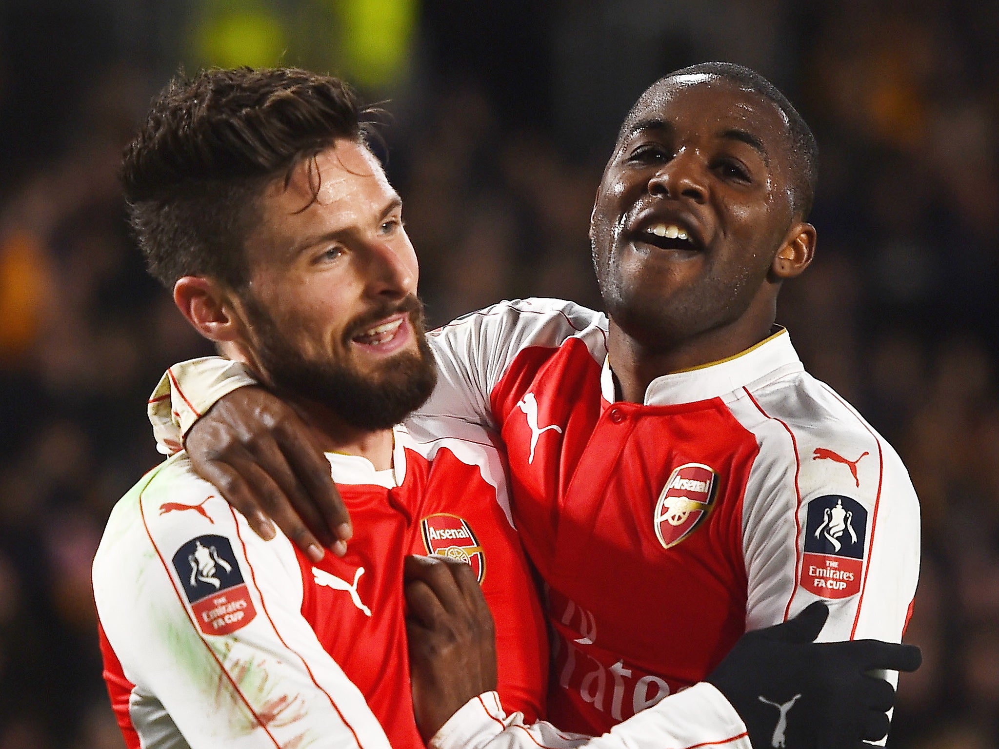 Olivier Giroud and Joel Campbell celebrate