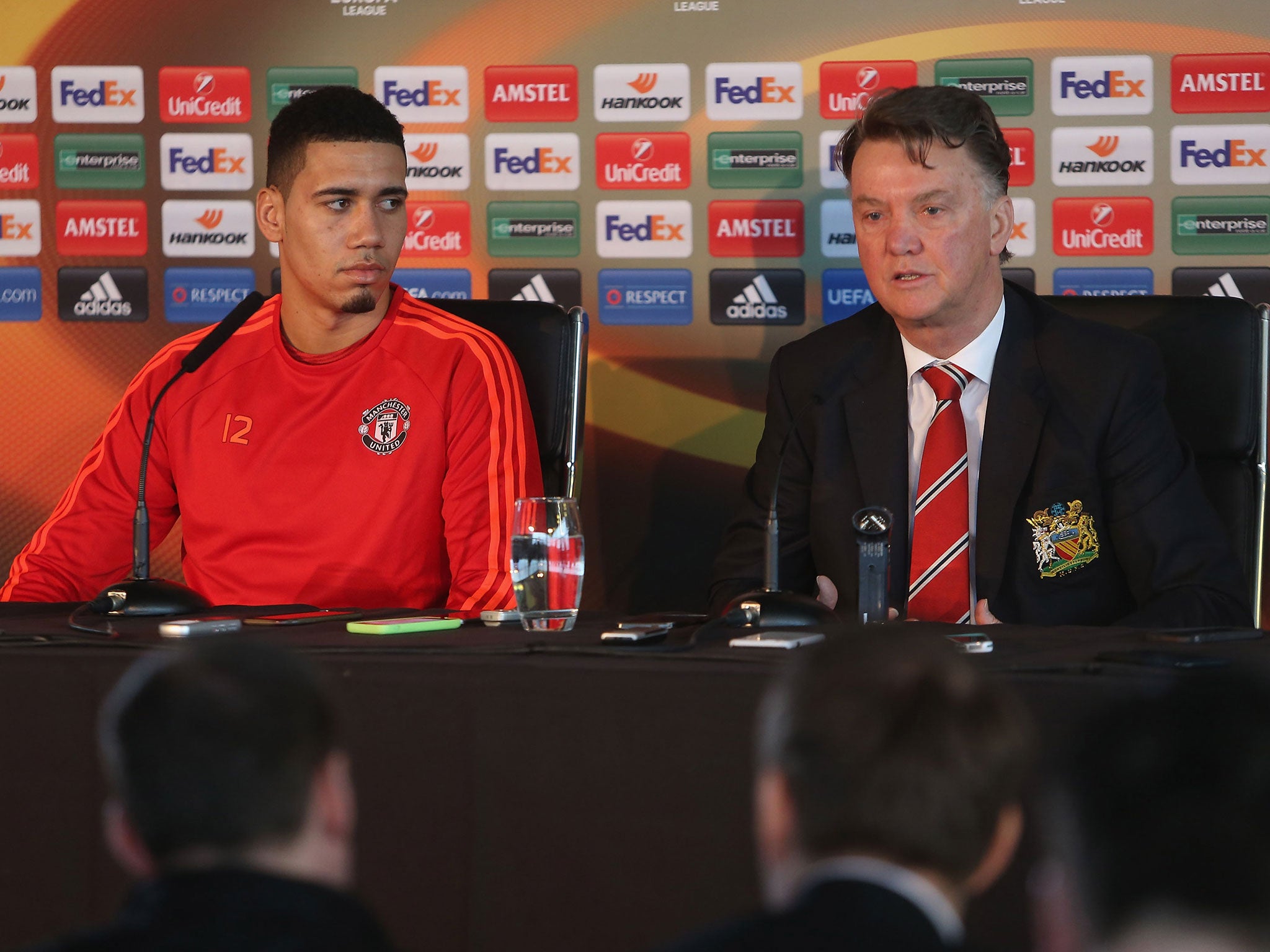 Manchester United defender Chris Smalling alongside manager Louis van Gaal