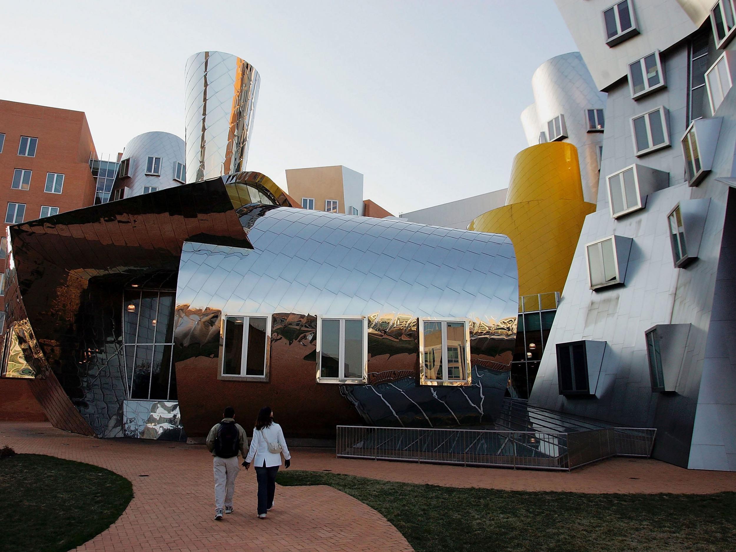 Students walk across the MIT campus, where the program was developed