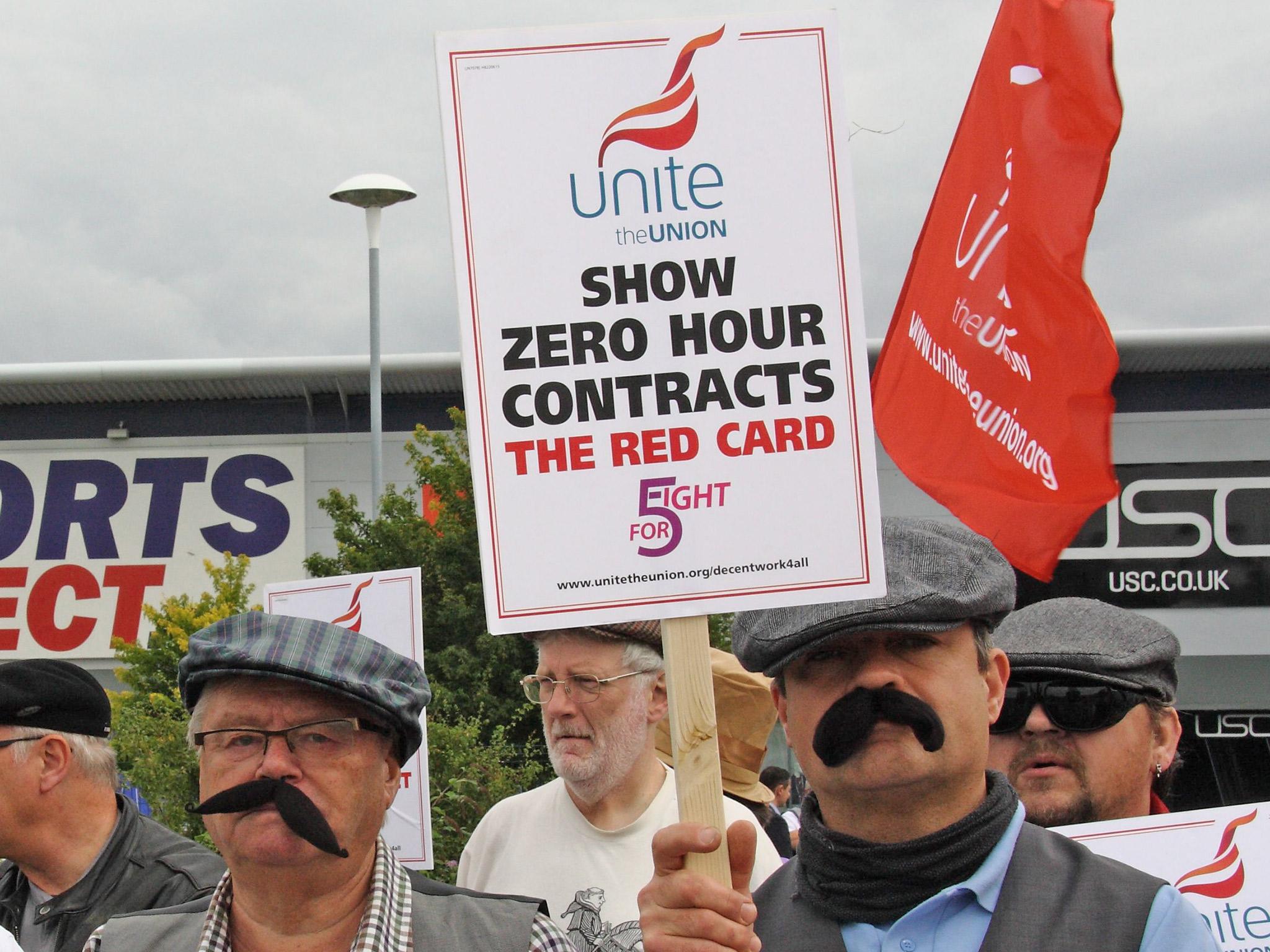 Unite union members dressed as Dickensian workers protesting against zero-hours contracts outside the headquarters of Sports Direct