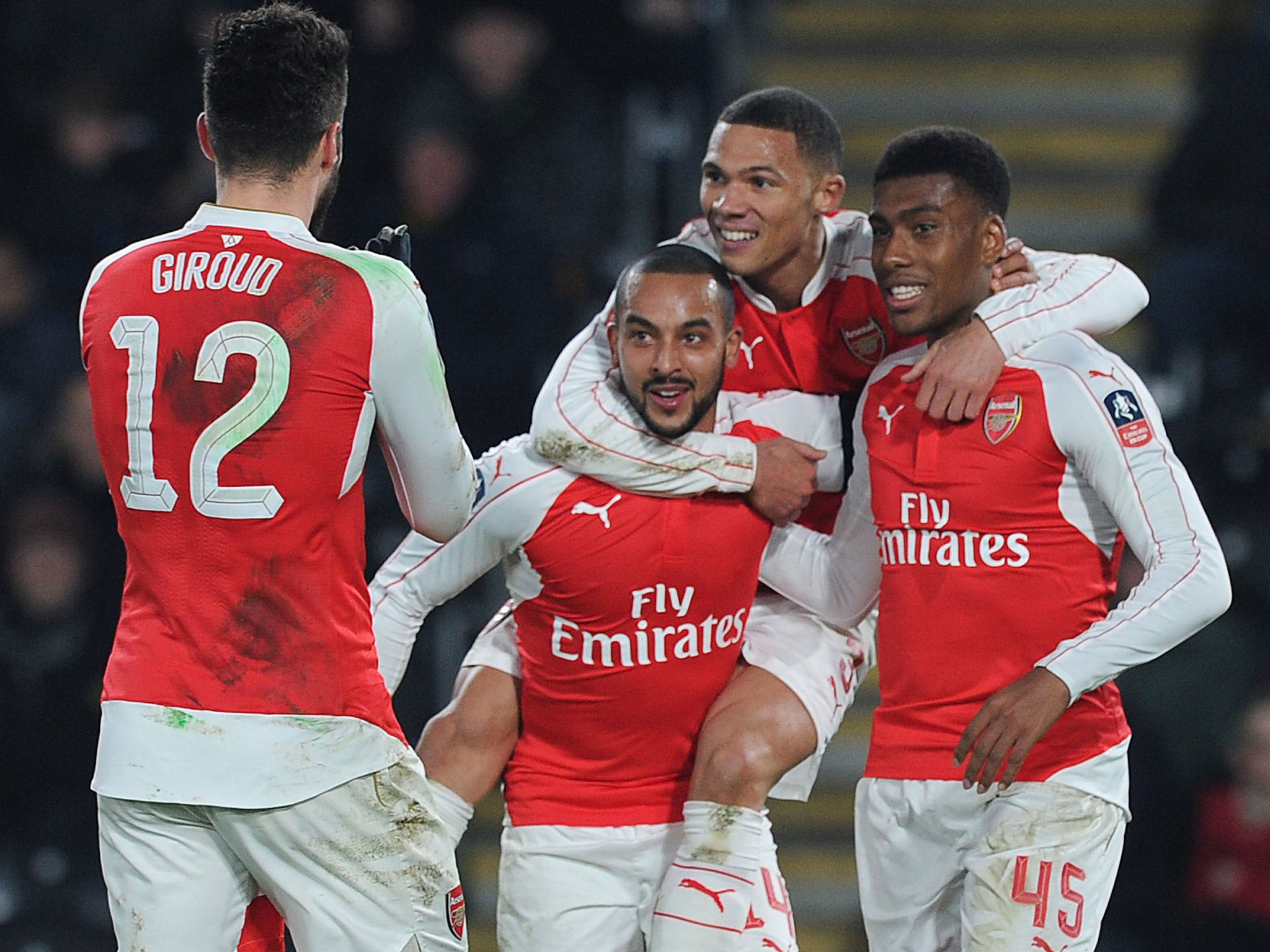 Arsenal players celebrate their third goal, scored by Theo Walcott, on Tuesday night