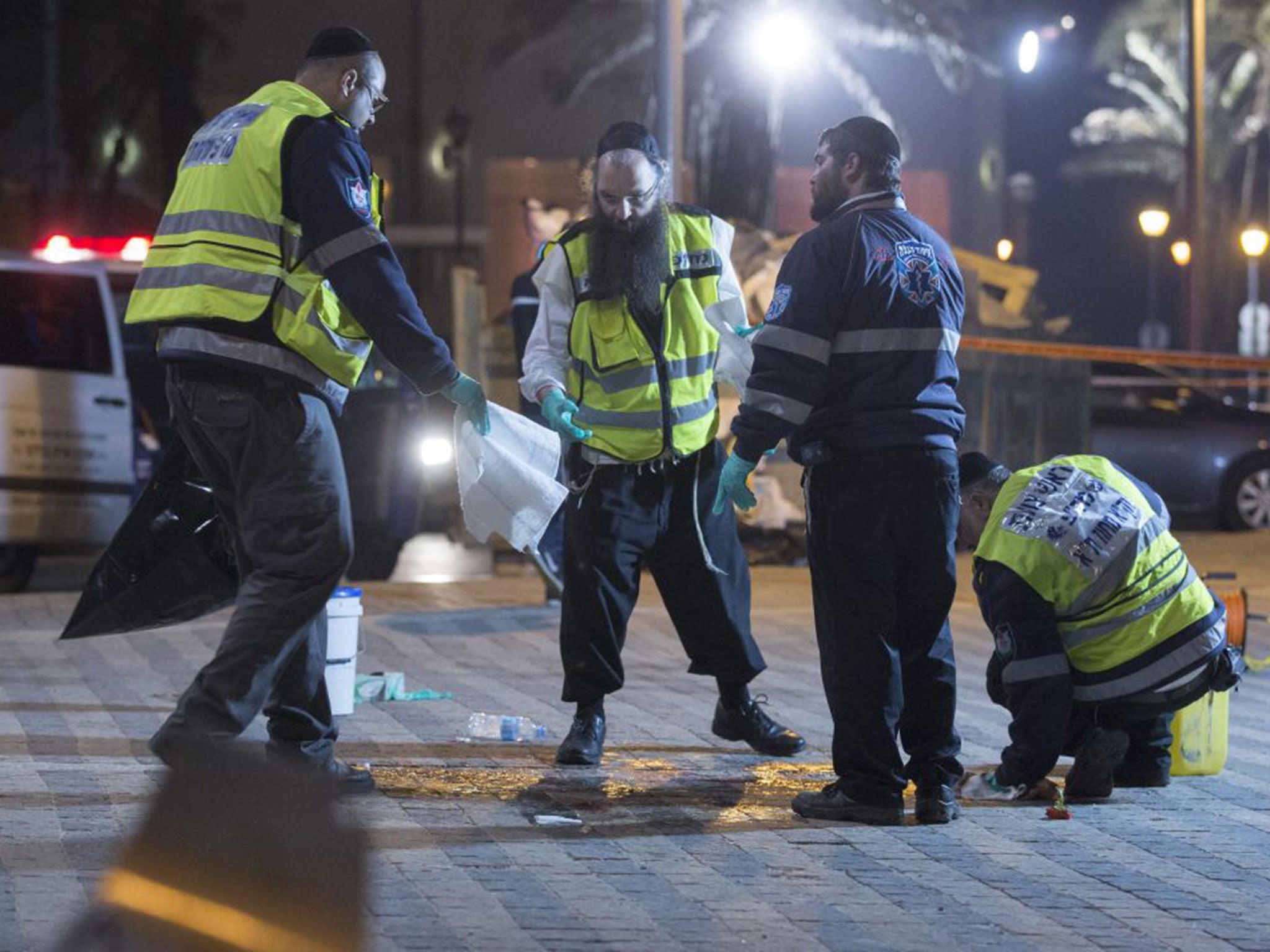 The clean-up operation gets underway at the scene of the stabbing attack in old Jaffa, just south of Tel Aviv, Israel