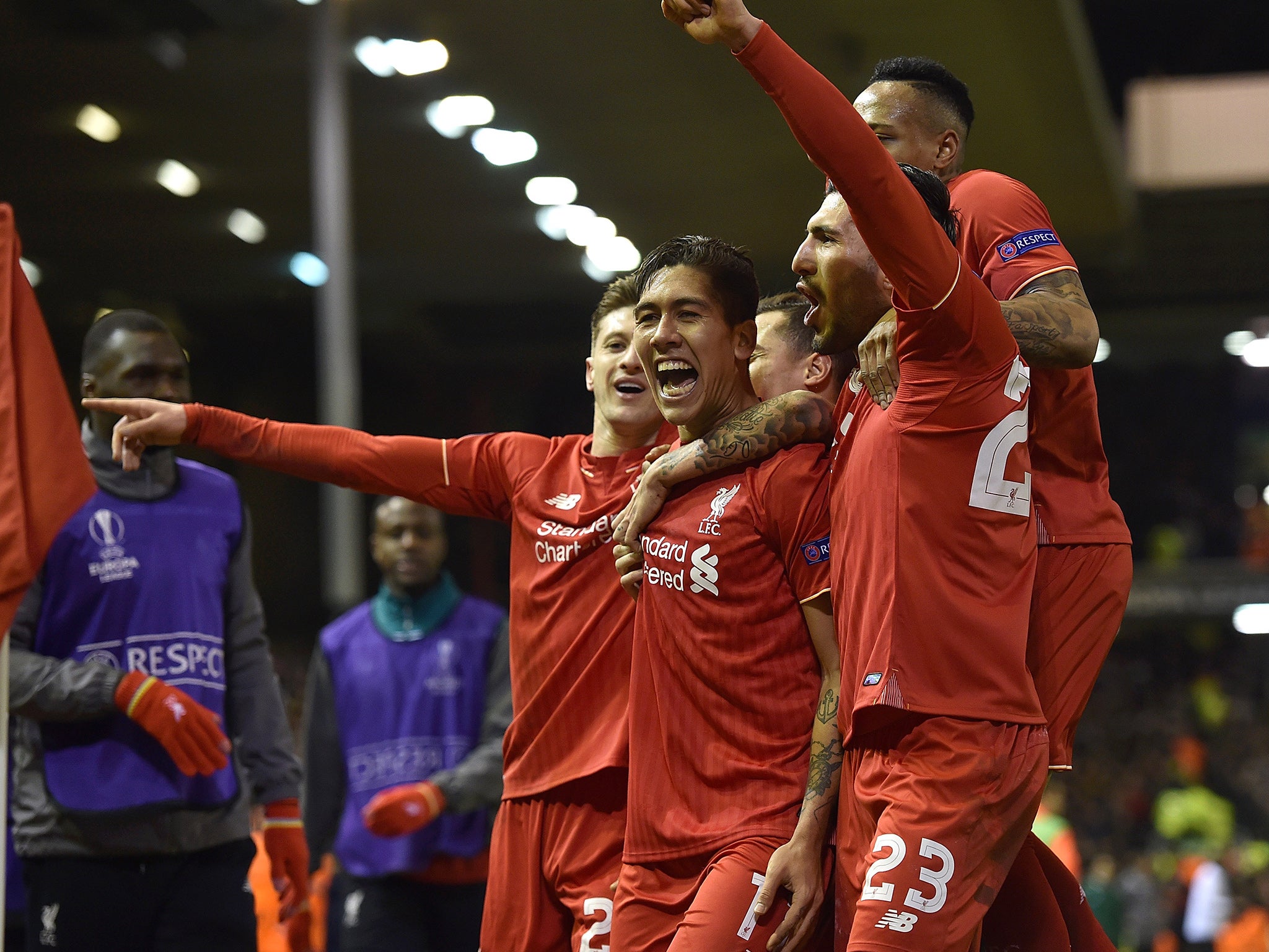 Liverpool's players celebrate with Roberto Firmino after his second-half strike