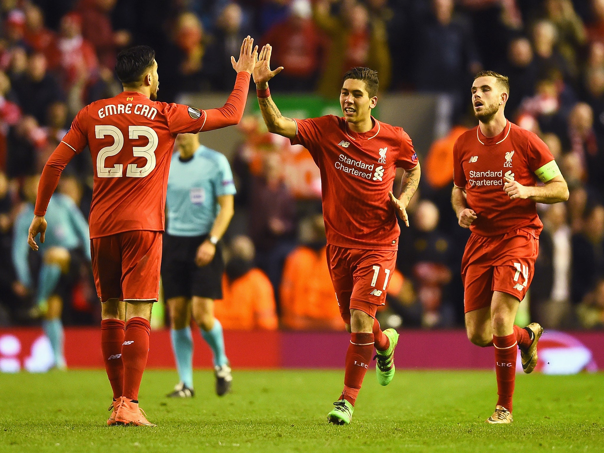 Roberto Firmino celebrates scoring Liverpool's second goal of the night