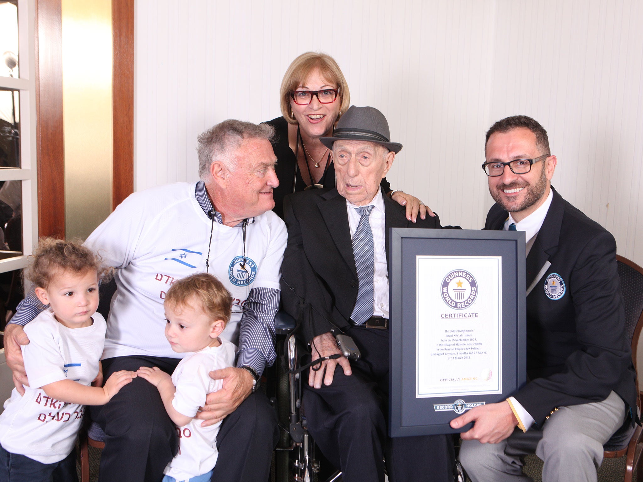 Israel Kristal with head of Guinness World Records records team Marco Frigatti, Israel's son Heim Kristal, daughter Shula Kuperstoch and great grandchildren