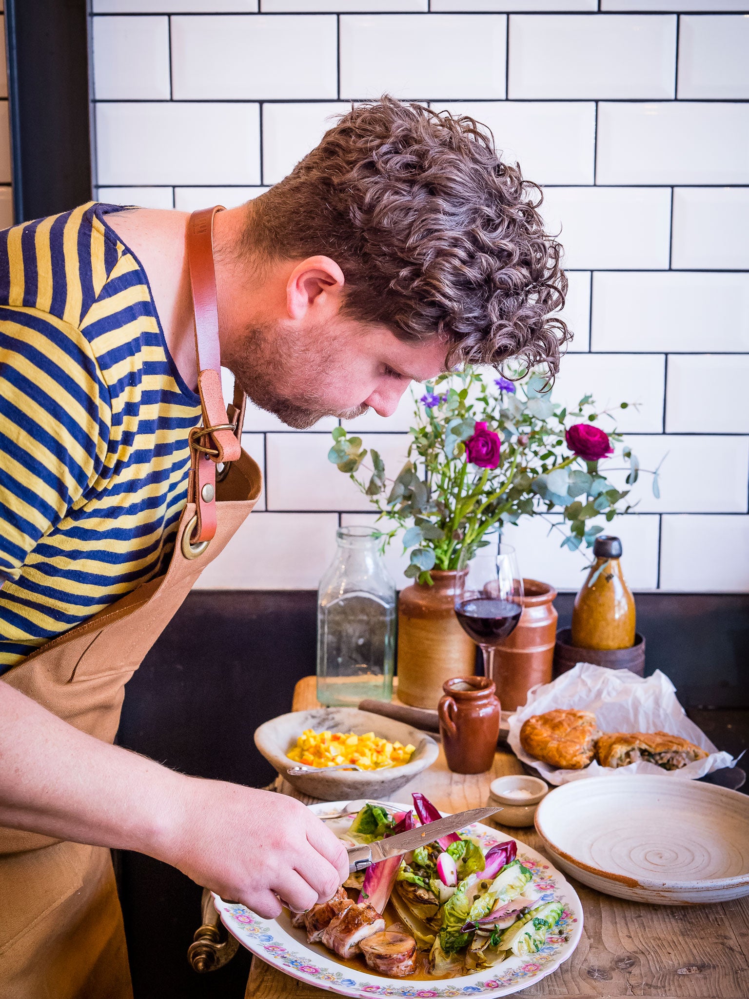 Plating up the roast saddle of rabbit