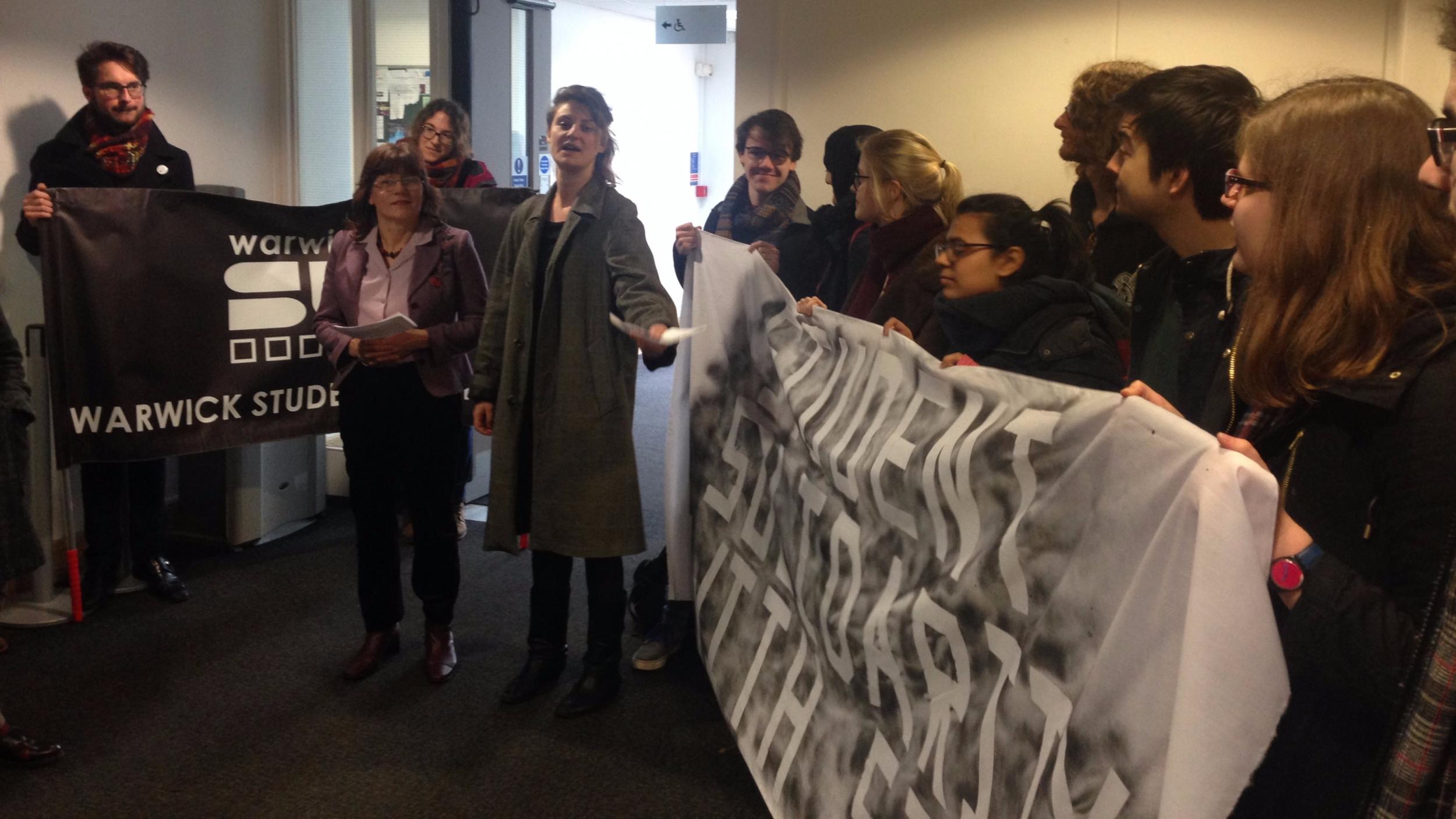 Staff read out the results of both motions to awaiting students after the debate