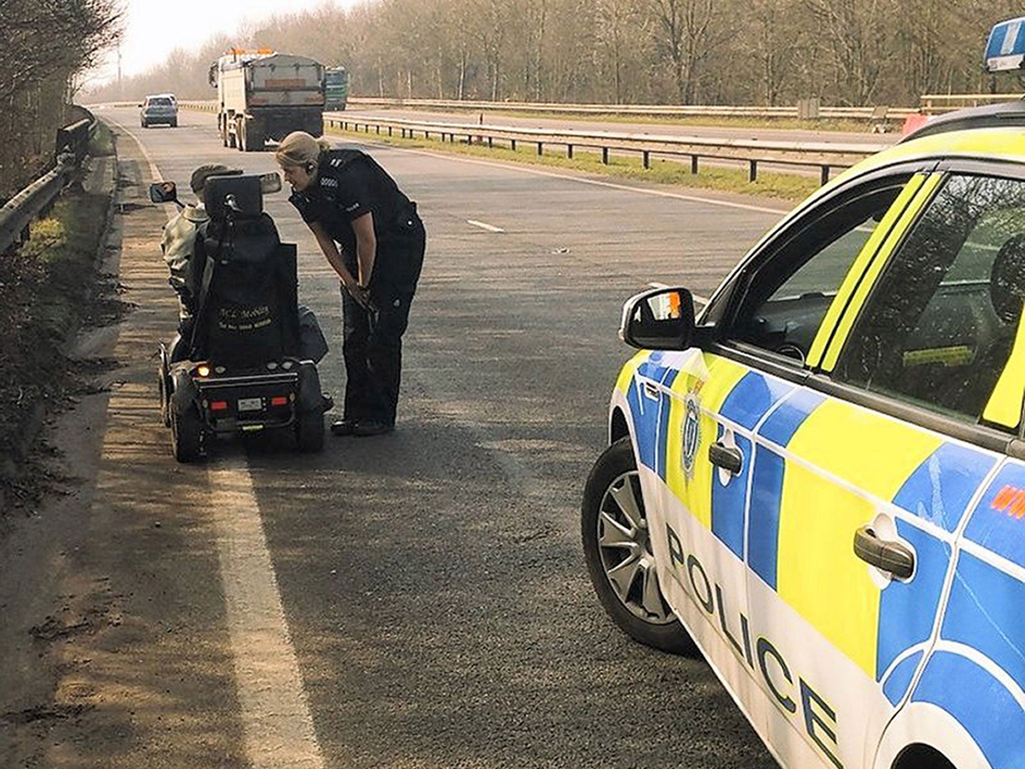 The 92-year-old on his mobility scooter being approached by police