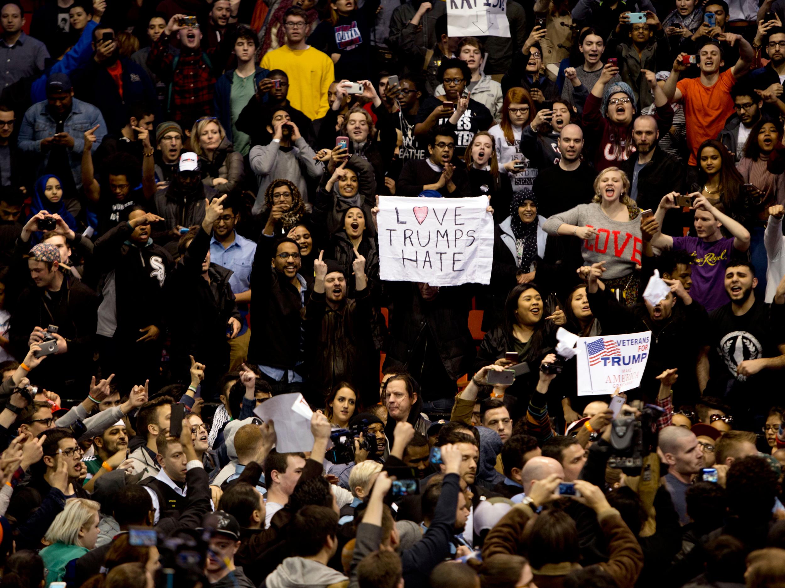 Anti-Donald Trump protesters confront with his supporters during a Trump rally at the UIC Pavilion in Chicago Getty