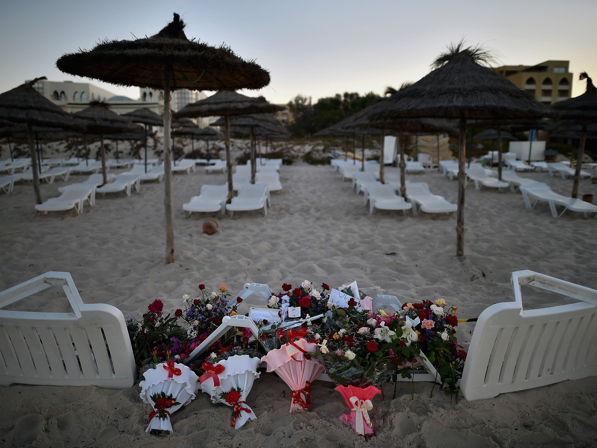 Flowers are placed at the beach next to the Imperial Marhaba Hotel where 38 people were killed in a terrorist attack on June 27, 2015 in Souuse, Tunisia.