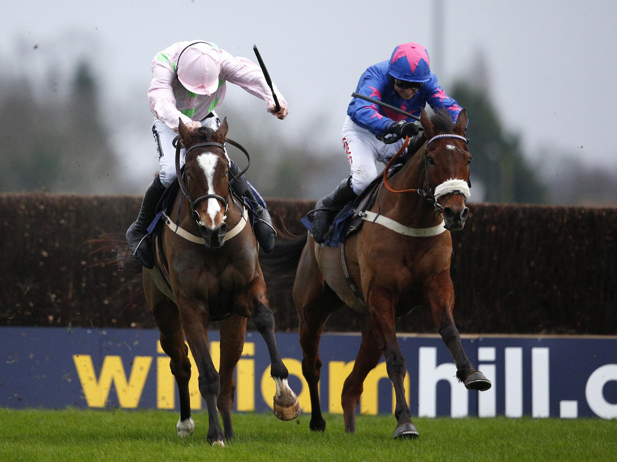 Vautour (L) and Cue Card (R) clash in the King George VI Chase