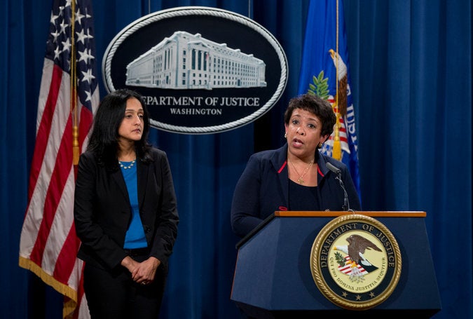 Vanita Gupta, left, and Loretta Lynch at press conference in February. Carolyn Kaster/Associated Press