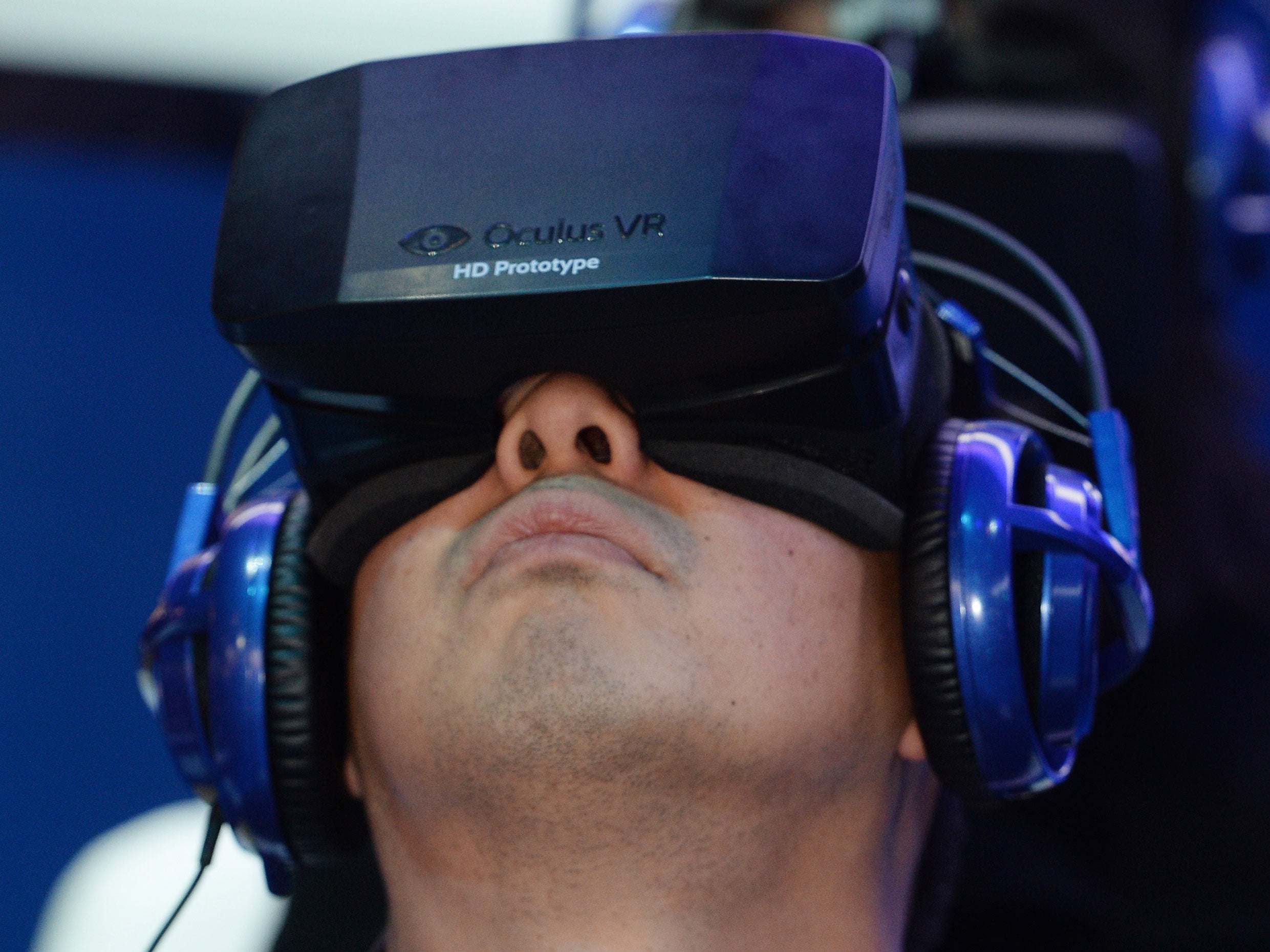 A man uses a prototype Oculus Rift at CES 2014