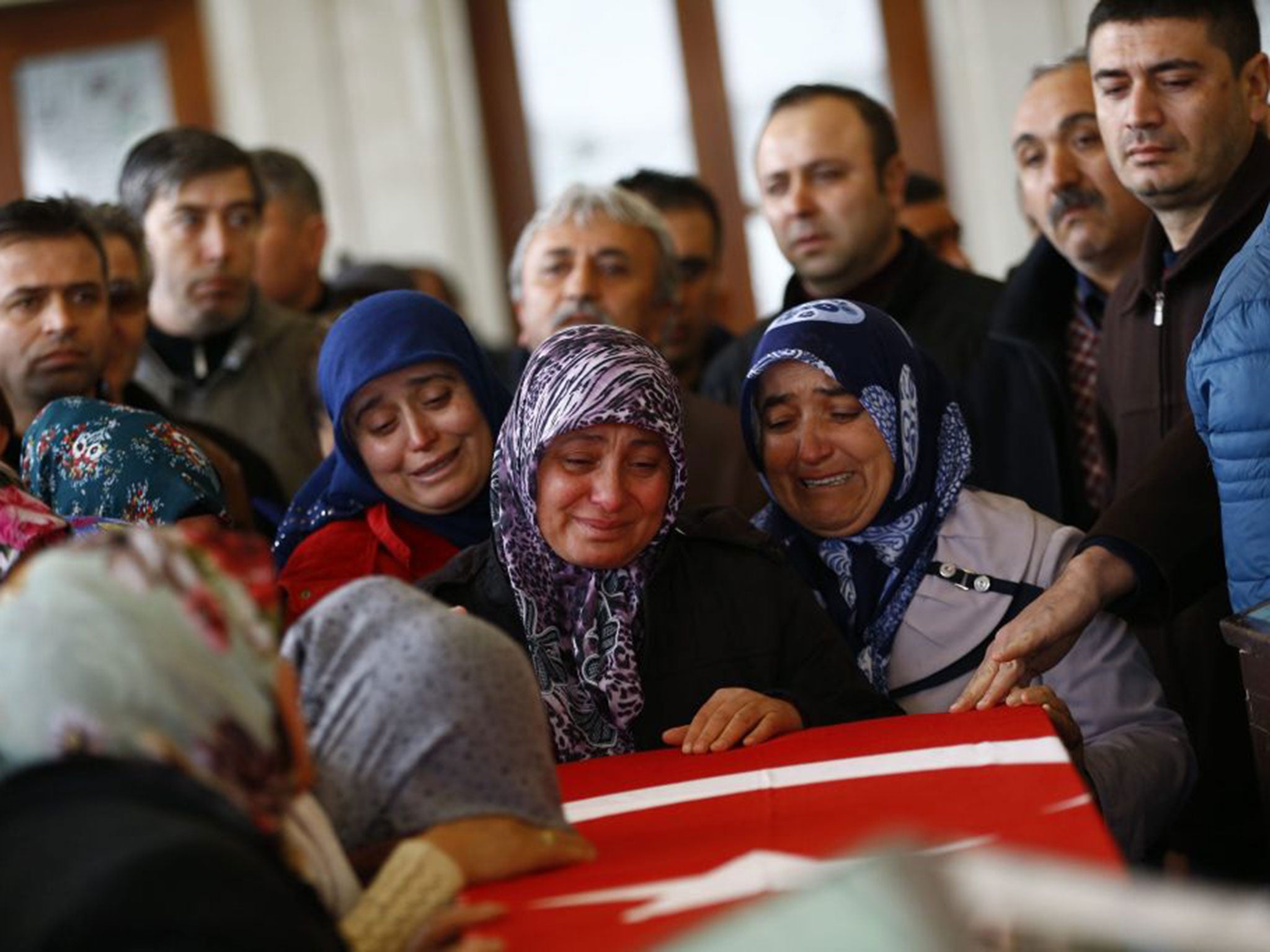 Relatives of Murat Gul, one of the victims of Sunday’s bomb near a bus station in Ankara, mourn at his funeral