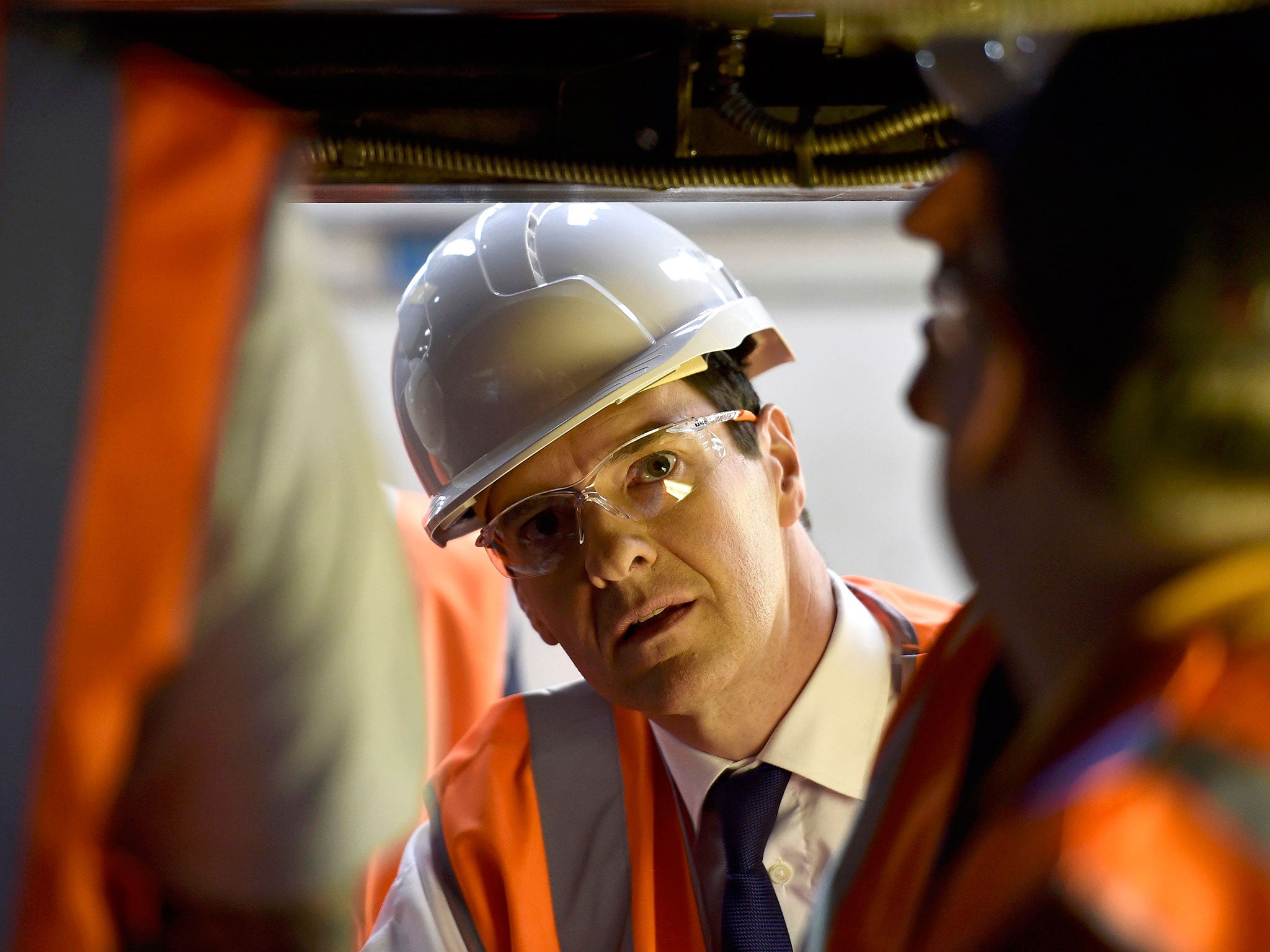 George Osborne visits a train maintenance plant in Crewe on the election campaign trail in 2015